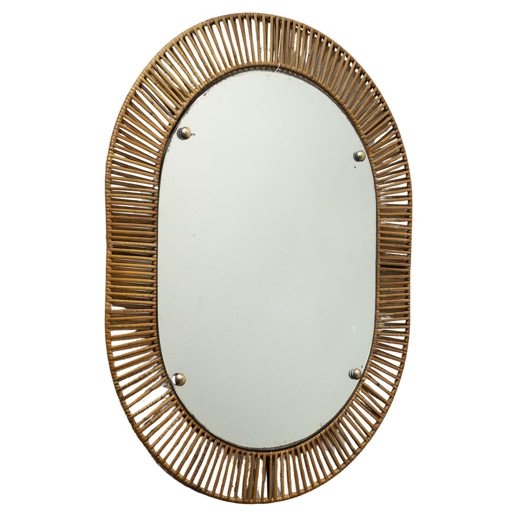 Refined bamboo mirror with wrought iron frame, Italian production in the late 1950s
Mirror measures W 46 H 64 cm.