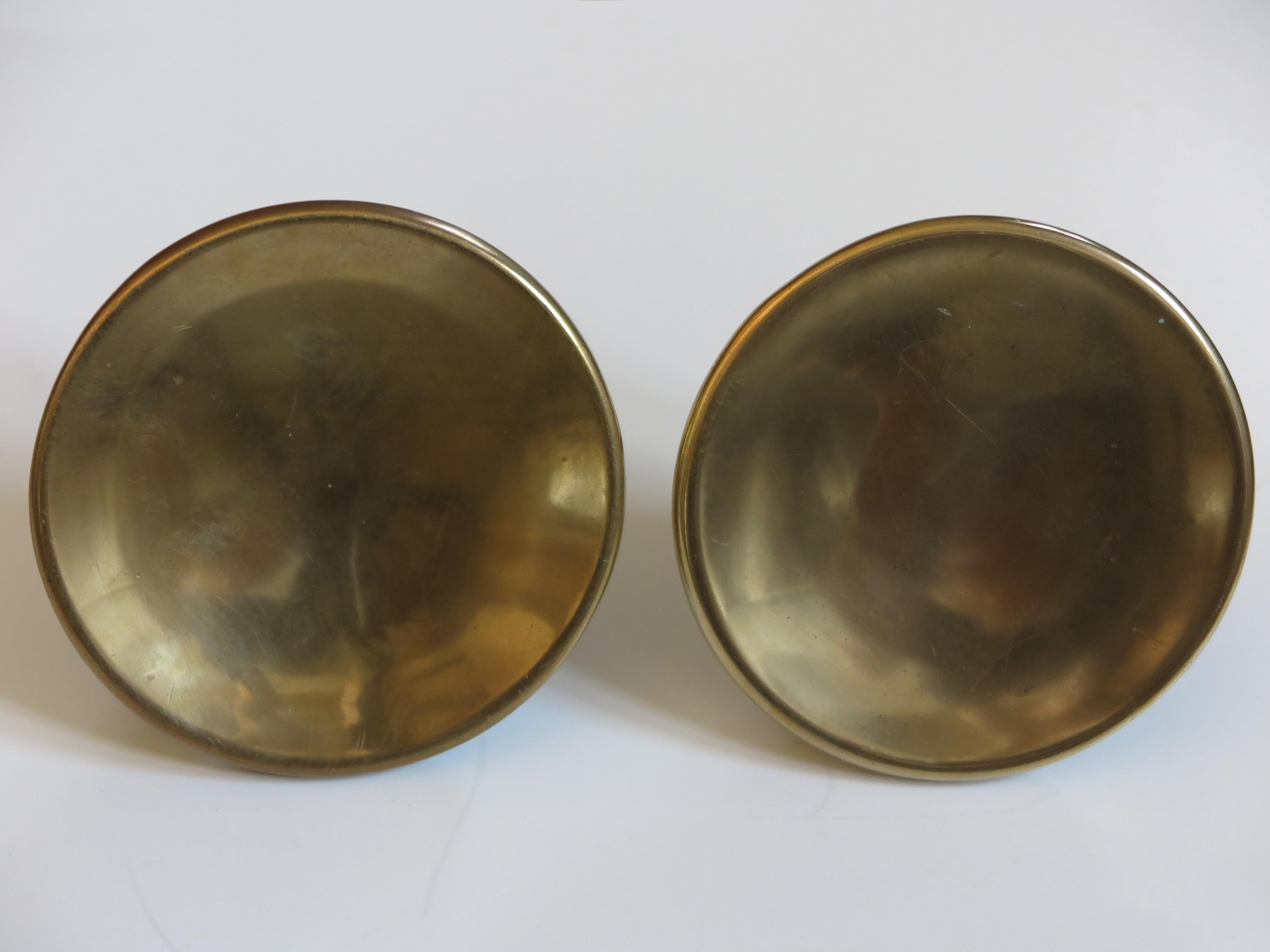Set of two rare and amazing big Italian solid brass door handles, 1950s

Please note that the items are original of the period and this shows normal signs of age and use.

Dimensions: diameter 14.5 cm, depth without screw 5 cm, depth with screw