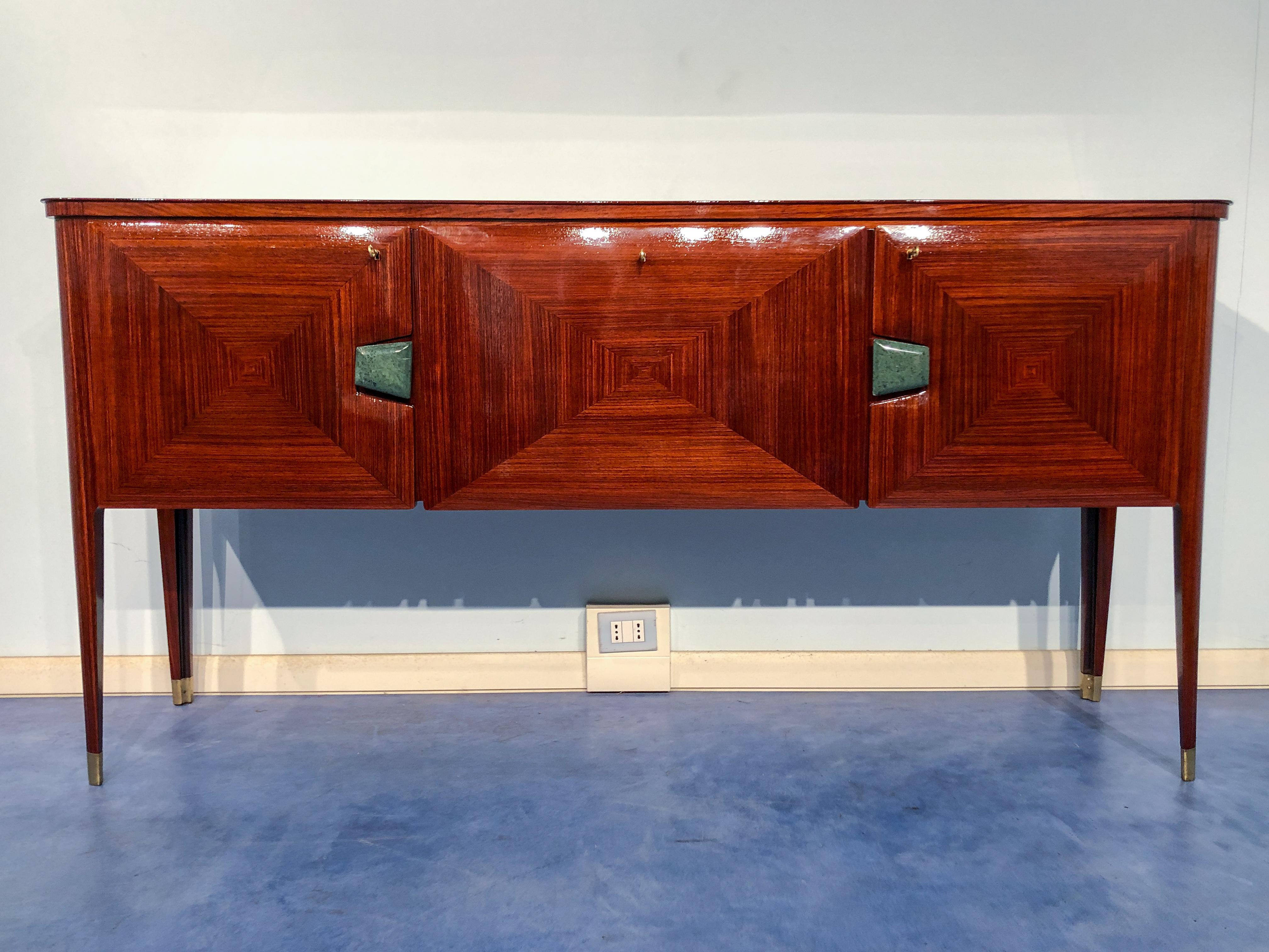 Beautiful Italian Mid-Century Modern rosewood sideboard designed by Vittorio e Plinio Dassi. Very elegance tapered legs with final sabots, three doors with the central one used a bar, refined design handles in precious green alps marble, interiors