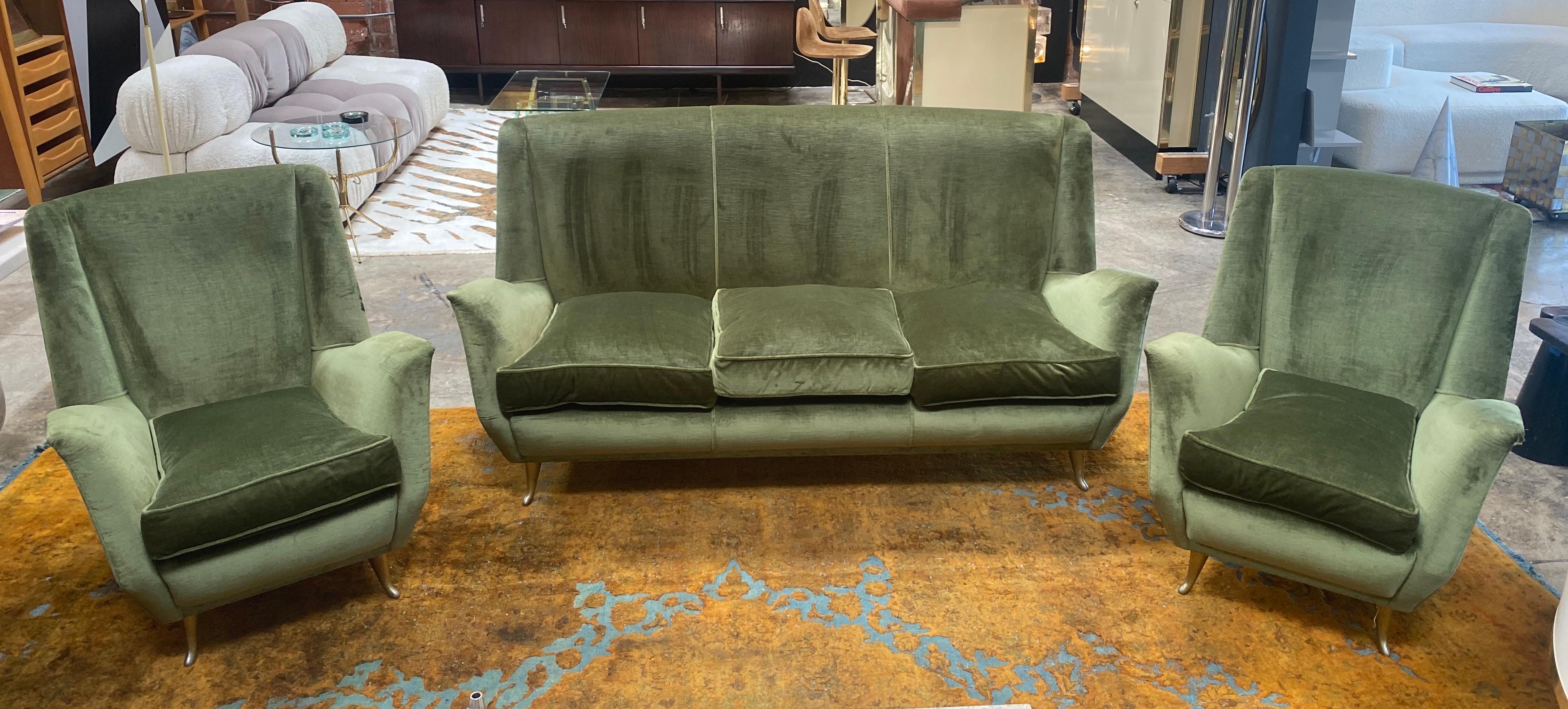 An elegant, stunning Italian Mid-Century Modern Sofa by ISA, Bergamo, 1955 including a pair of armchairs / lounge chairs / wingback / high back chairs and a sofa / couch. It is rare to find an entire set of pieces in original condition by a master