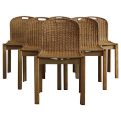 Ensemble de chaises à manger italiennes en osier:: années 60:: de style moderne du milieu du siècle dernier