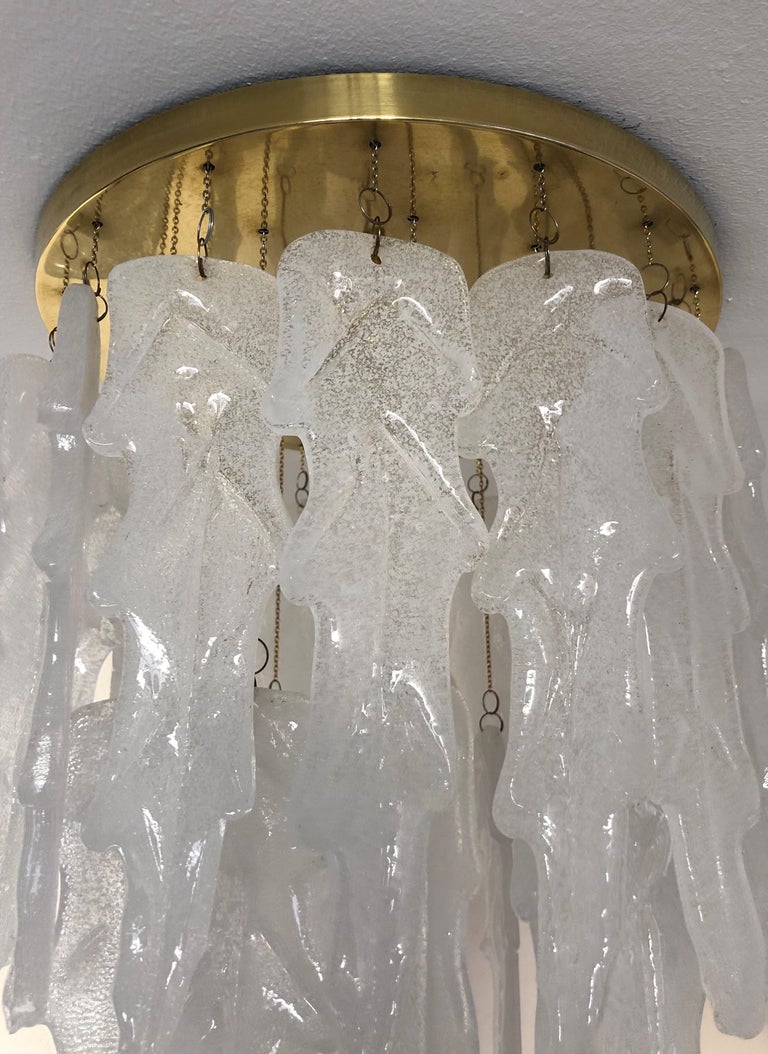 Stunning and beautiful Italian white Murano glasses midcentury chandelier. This chandelier was made during the 1970s in Italy for the Venice company “Mazzega”.
Mazzega lie in the noble Venetian glassworking tradition; the firm was founded Angelo