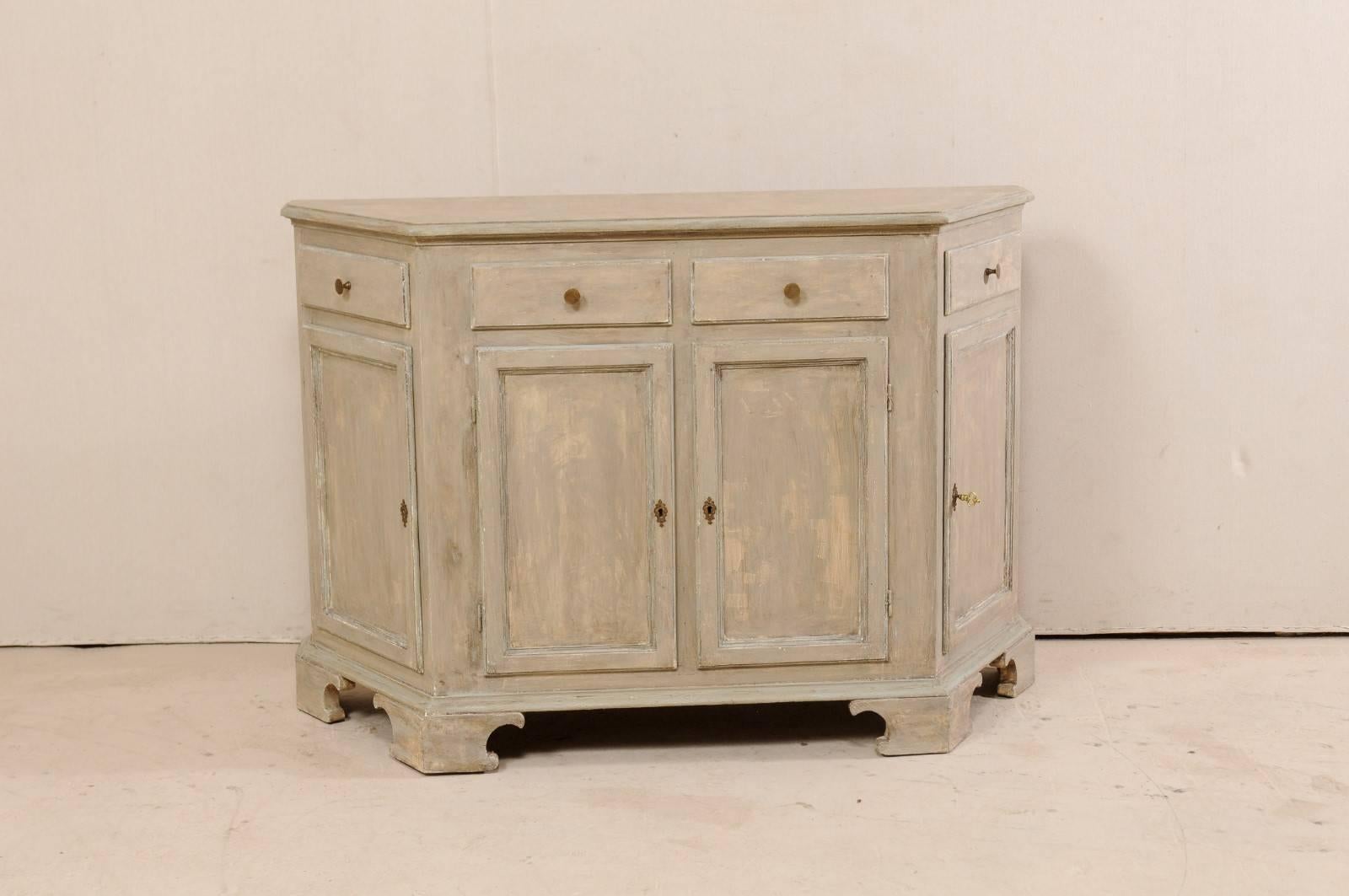An Italian midcentury painted wood console cabinet. This vintage Italian buffet cabinet features clean lines and trim with nicely canted sides. There are four drawers over four doors, two each paired at the centre, with a single drawer over a single