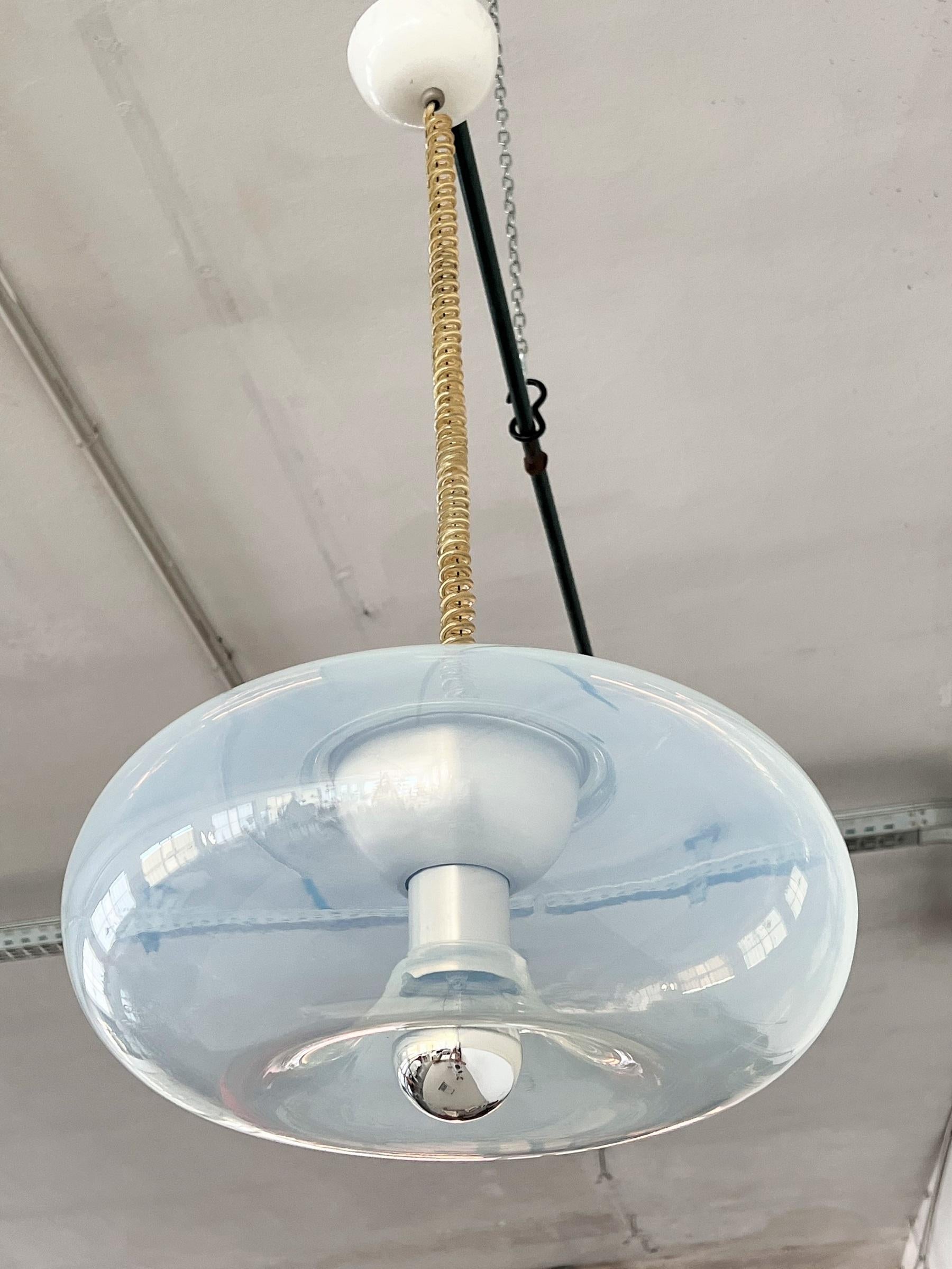 Beautiful and shiny handblown pendant light in Murano Opaline transparent glass with light blue glass effect with internal aluminium lamp holder.
With original curly wire.
Designed by Carlo Nason, produced by Leucos, during the 1970s.
The bulb
