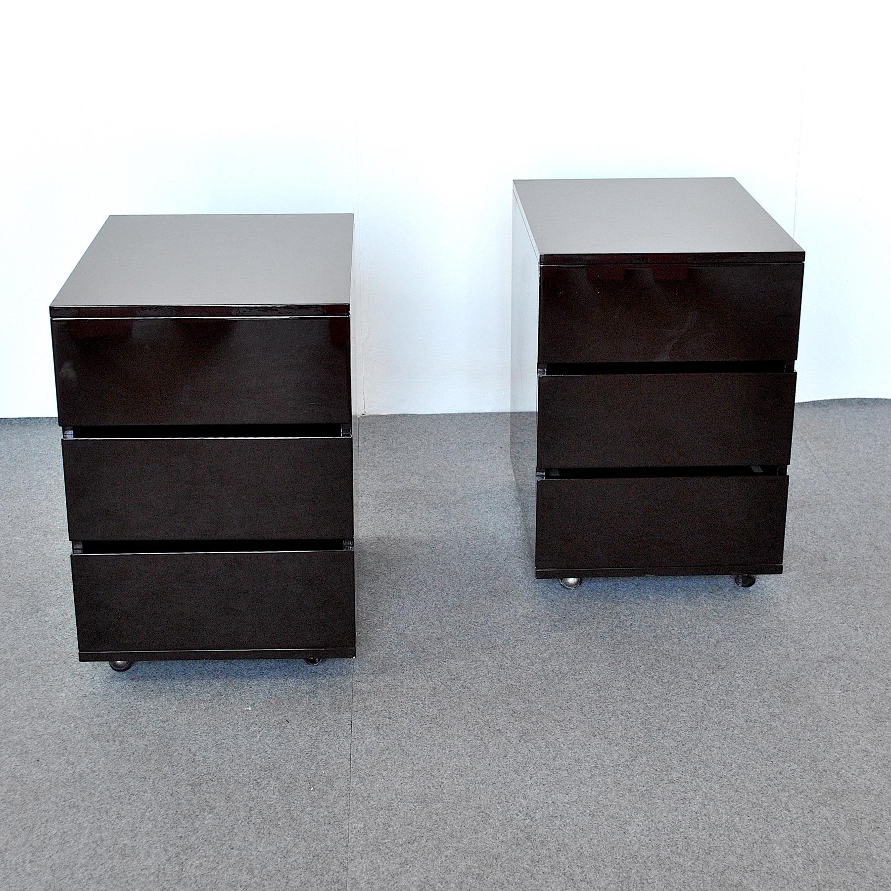 Set of two night stands cabinets with three drawers in dark brown lacquered wood, Italian production from the 1980s.