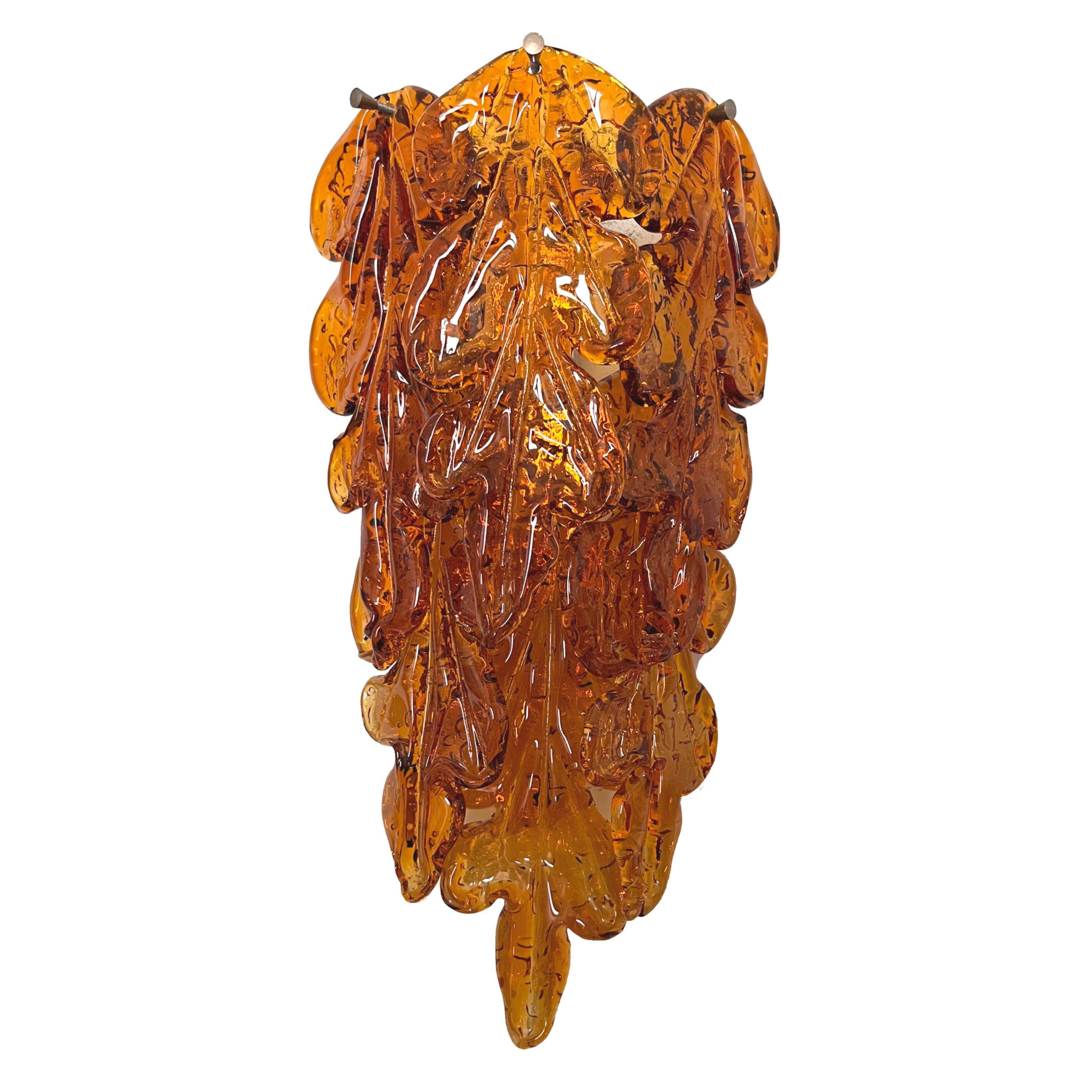 Marvelous, stunning and long pair of Italian amber Murano glass wall sconces from 1970s. These fixtures were made during the 1970s in Italy for the Venice Company “Mazzega”.
Each wall sconce is composed by 6 units of Murano glasses and metal