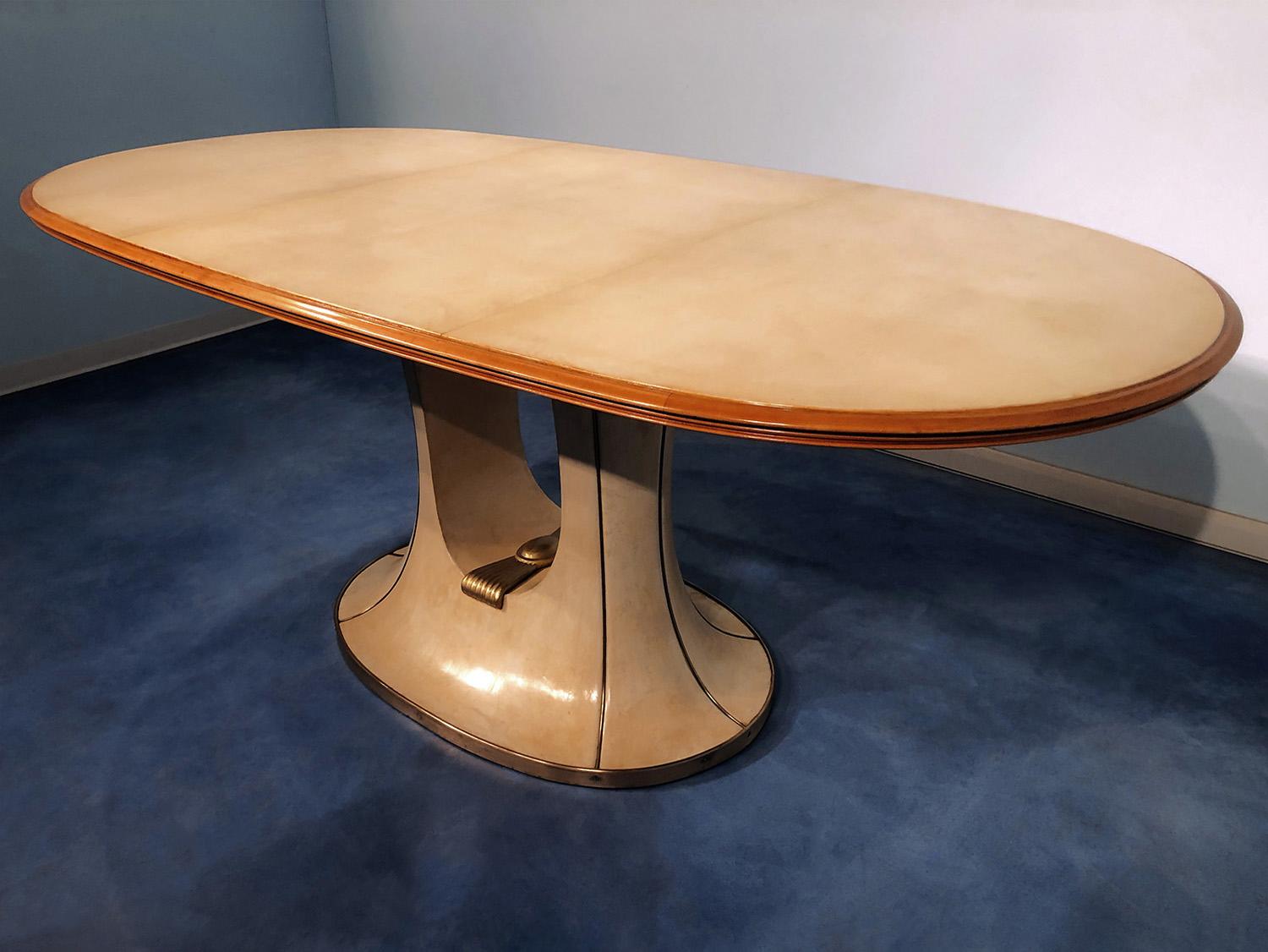 Stunning and very rare oval dining Table very well designed by Vittorio Dassi between the 1940s and 1950s, characterized by tabletop covered in parchment.
This Table is in its original state, it's coming from a Sicilian villa in Palermo, in good