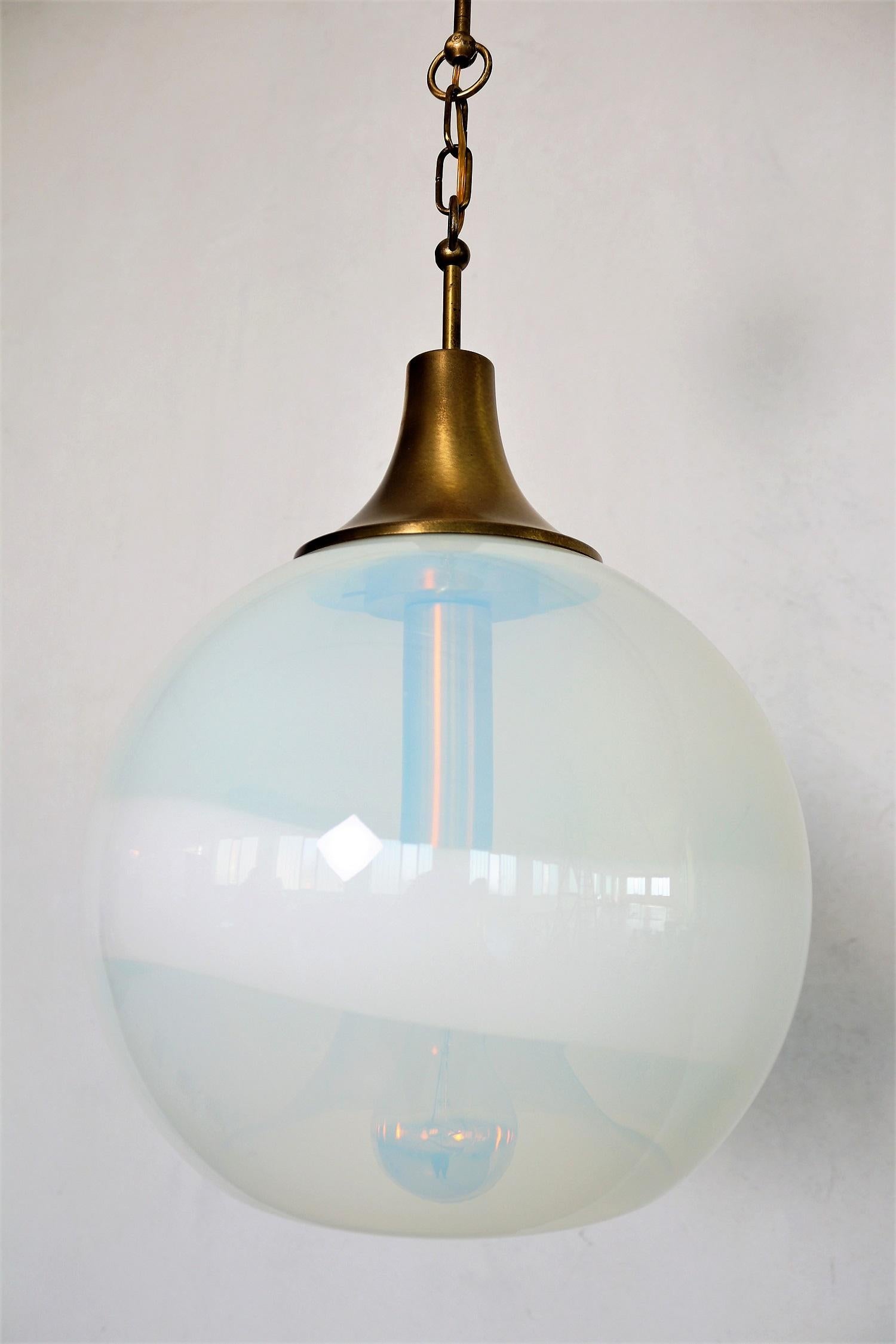 Elegant Italian pendant lamp with magnificent opaline Murano glass designed by Carlo Nason for Mazzega AV.
Made in Italy in the 1960s.
The brass is with beautiful patina.
Wiring and bulb holder (for one standard Edison bulb E27) have been