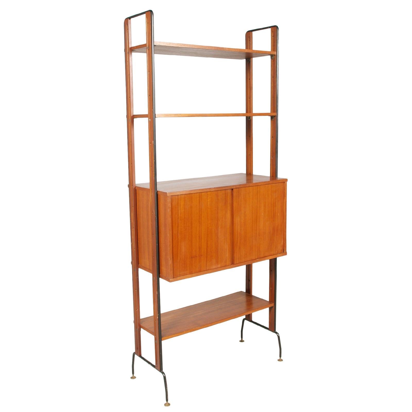 1950s number two modules book shelfs with two storage units, La Permanente Mobili di Cantu, Franco Albini Franca Helg manner in solid teak wood, teak wood veneer of storage cabinets and structure in black lacquered steel. Adjustable brass feet and