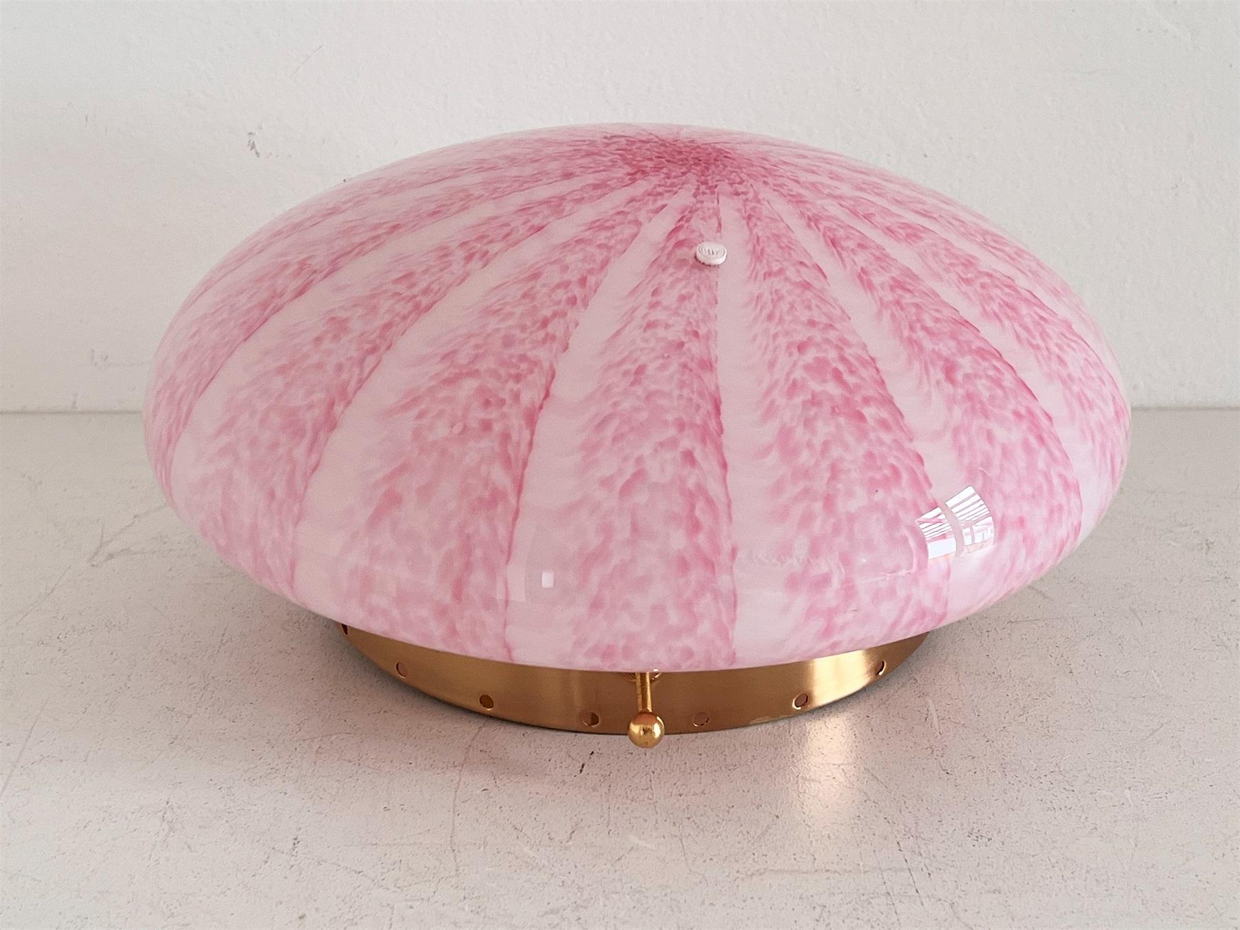 Gorgeous flush mount light or wall sconce produced from La Murrina, Murano, Italy in the 1970s.
With original manufacturers glass stamp.
The beautiful Murano glass is made in pink with stunning decor which leaves nice effects especially when