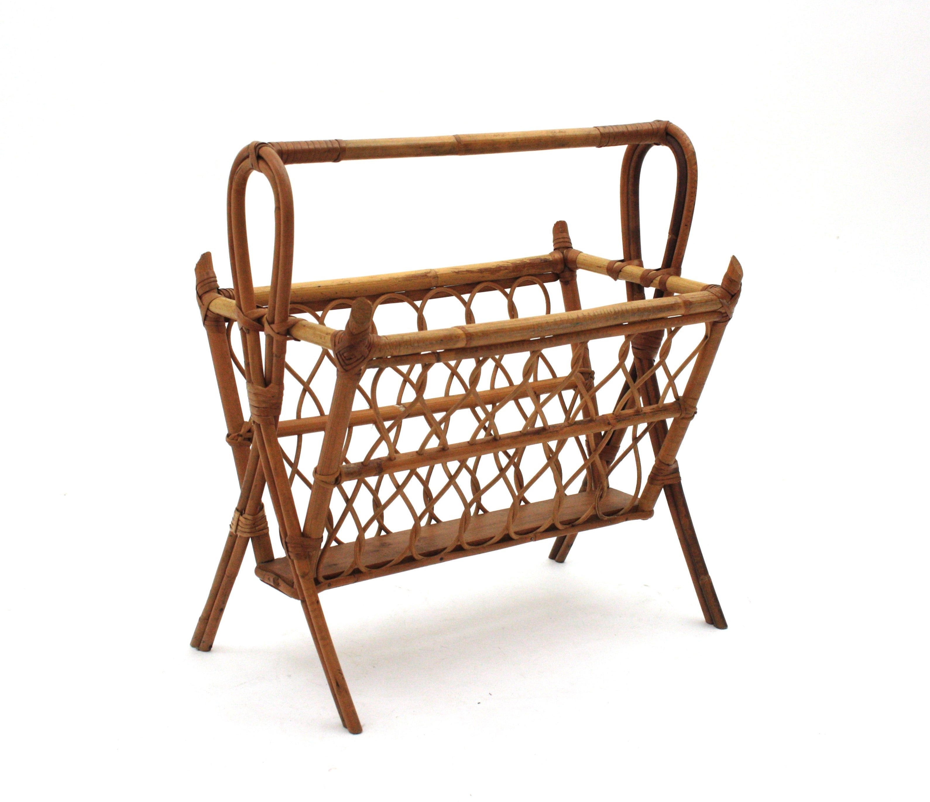 Mid-Century Modern Rattan Magazine Rack
Eye-catching handcrafted bamboo and rattan basket magazine rack in the manner of Franco Albini, Italy, 1960s.
This magazine stand features a conical bamboo basket with rattan loop decorations. 
Stylish from