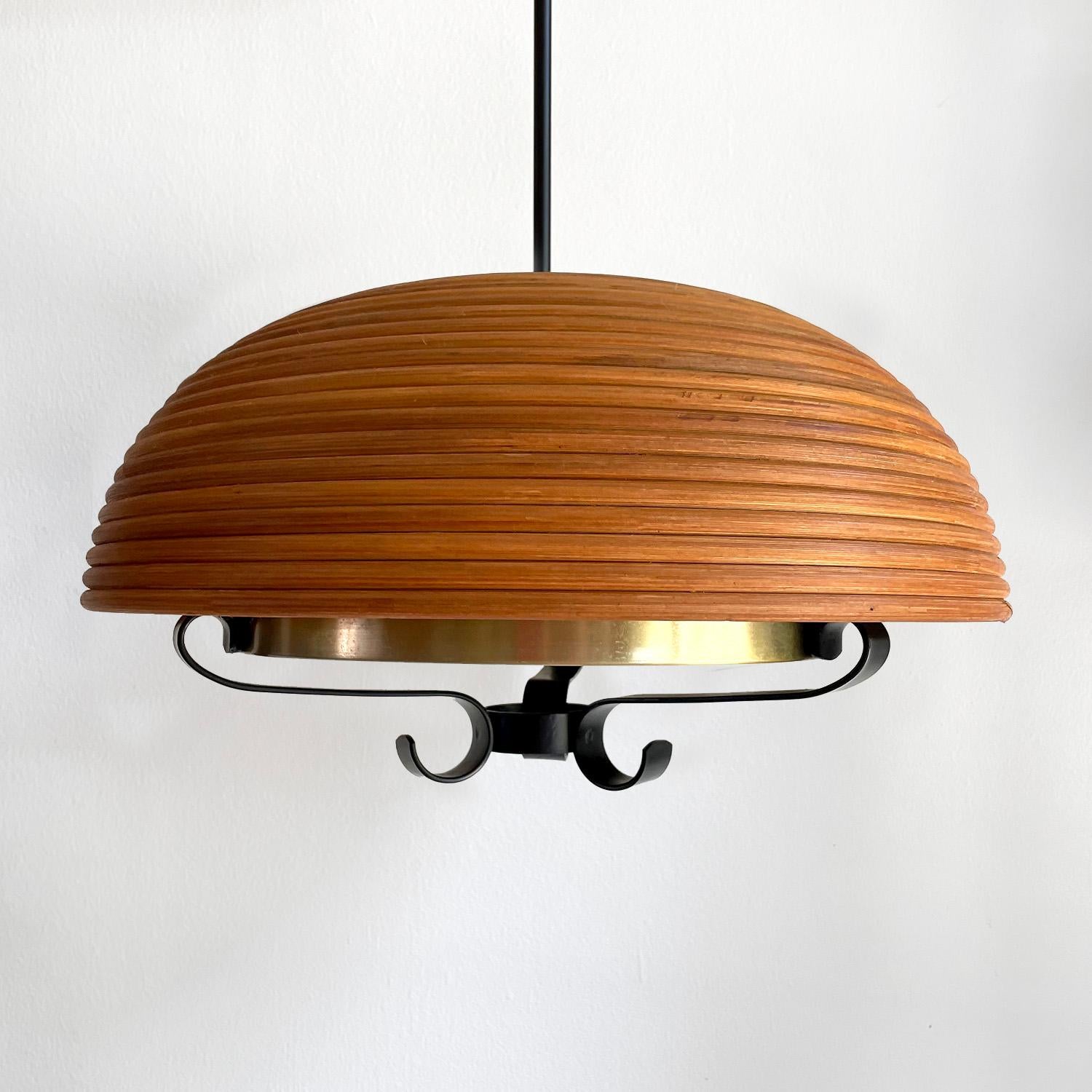 Italian rattan dome pendant light
Italy, circa 1960's
Original rattan dome
Wrought iron frame
Interior textured glass diffuser shade
Patina from age and use
Light surface markings to the top of the iron frame, please reference photos
Newly