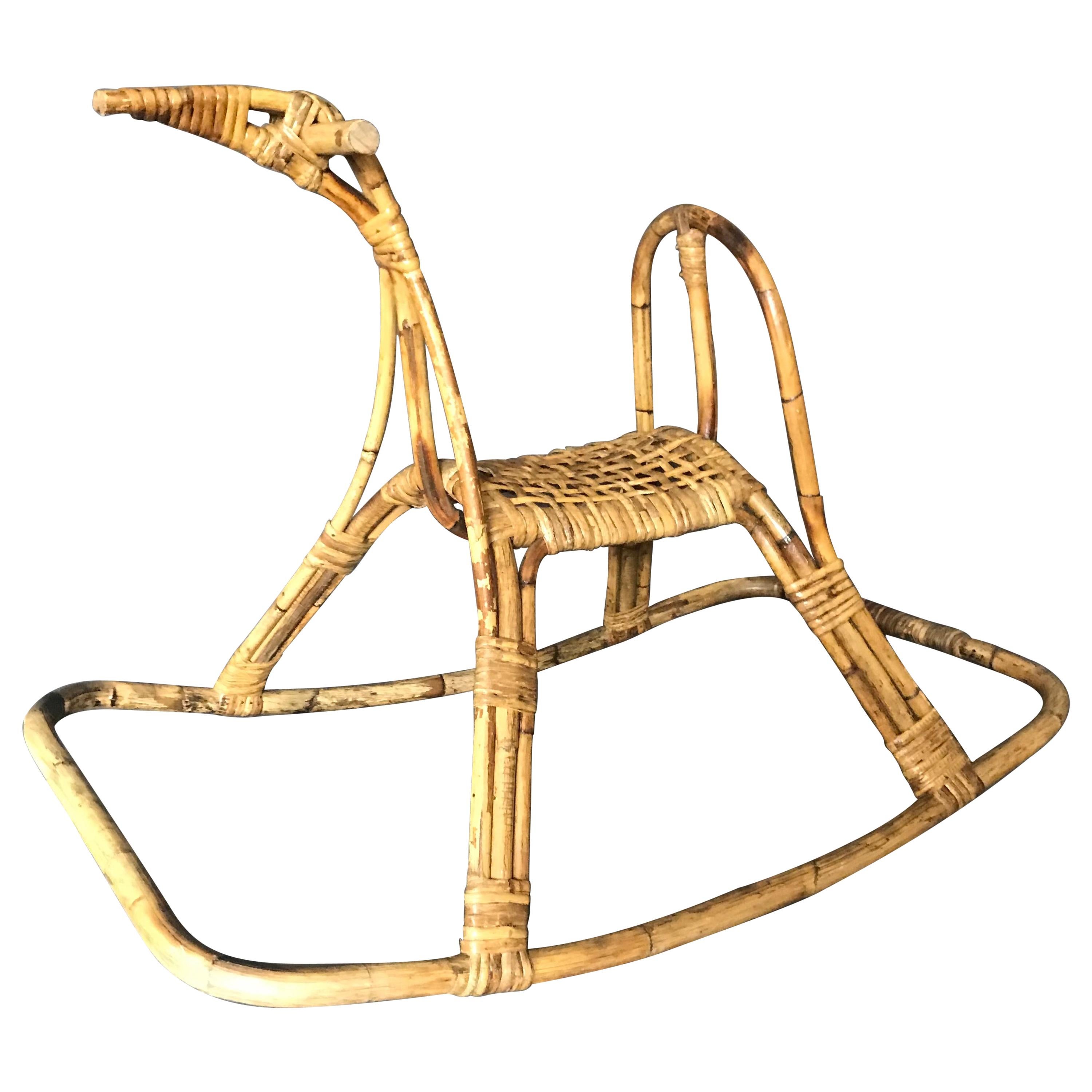 Italian Midcentury Rocking Horse Sculpture. Italian midcentury rattan rocking horse sculpture. Italy, circa 1960.
Dimensions: H 23 in. x W 30 in. x D 18 in.