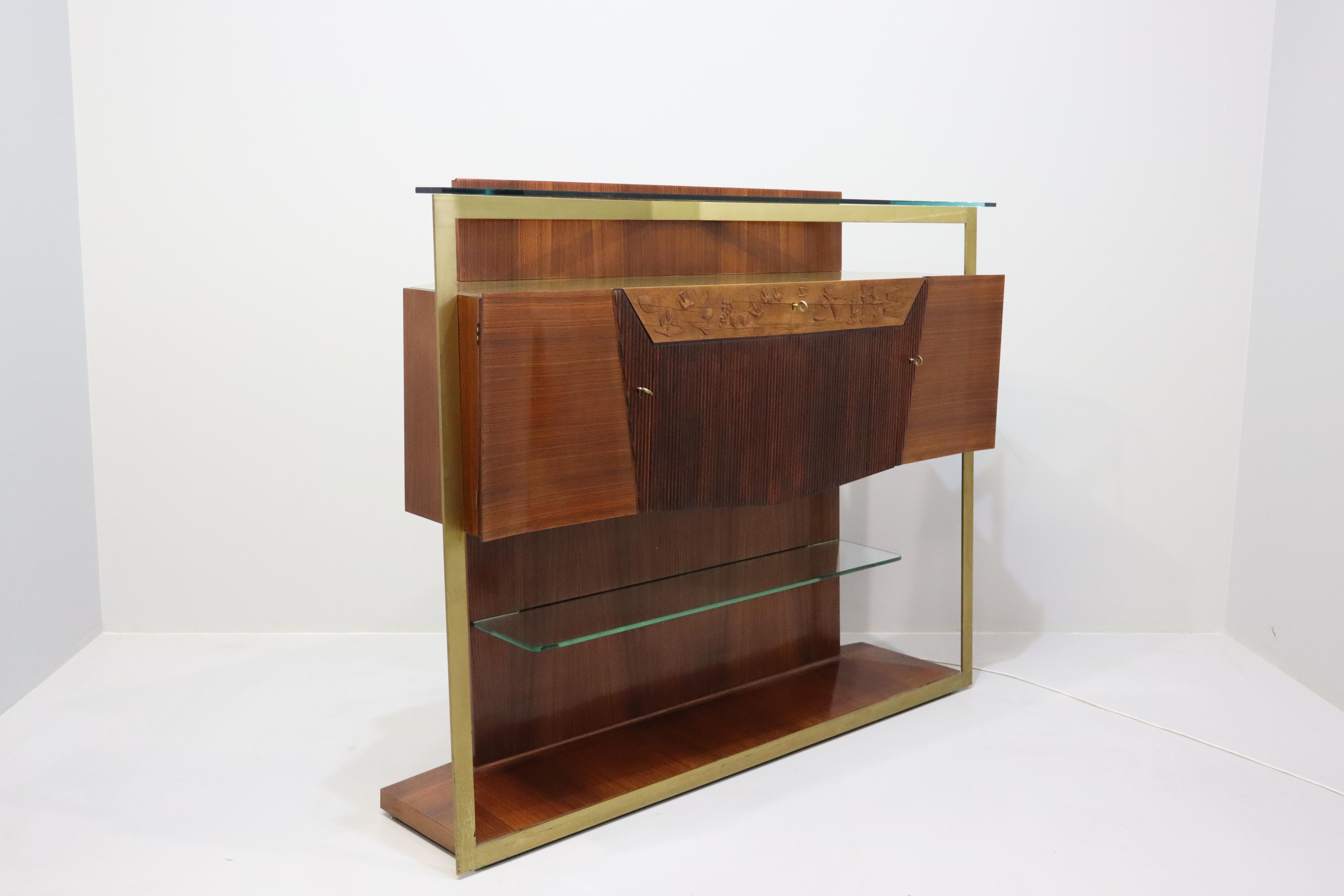 Spectacular rosewood sideboard and/or bar cabinet designed by Vittorio Dassi in the 1950s.
