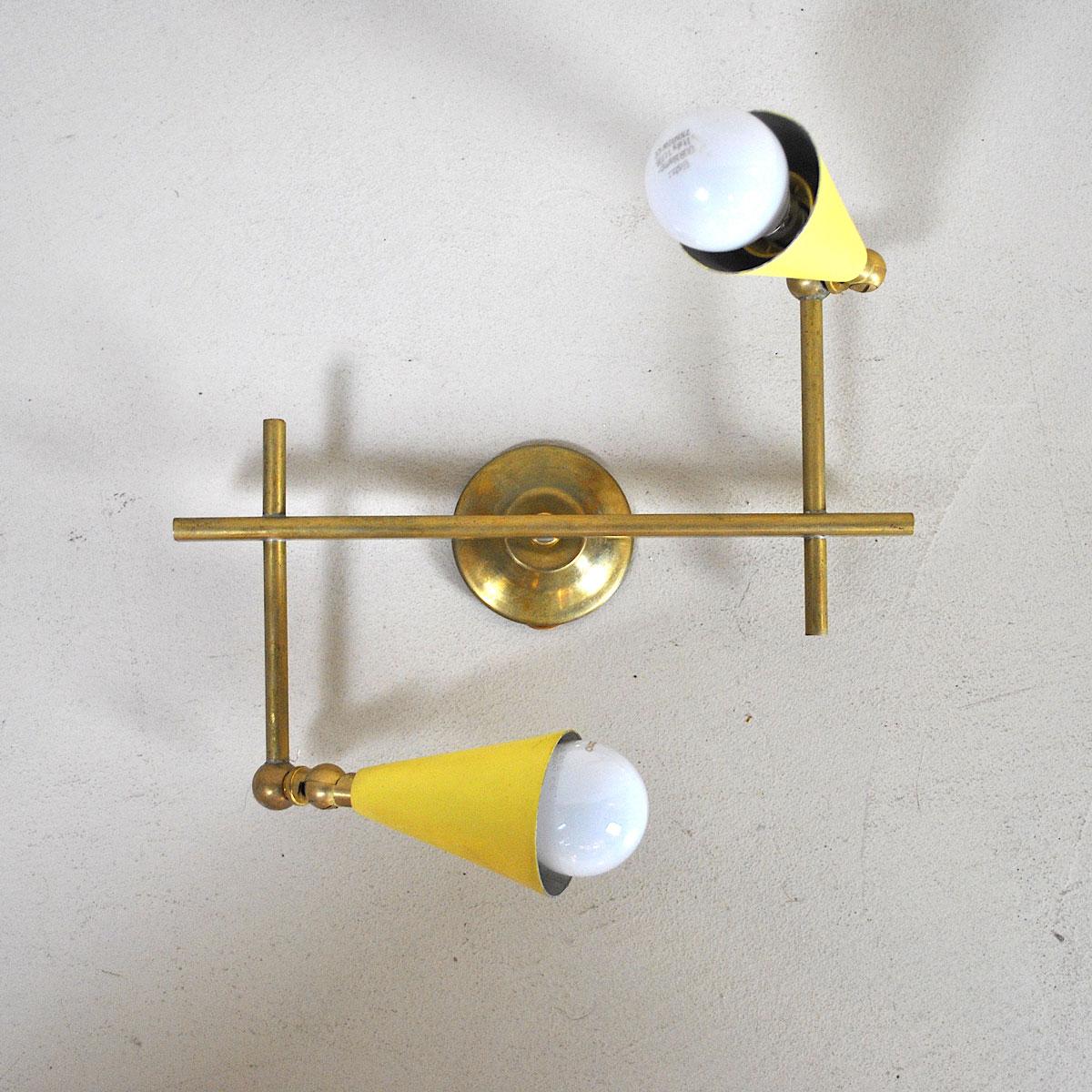 Italian sconce from the 1960s with a couple of cones on a brass structure.