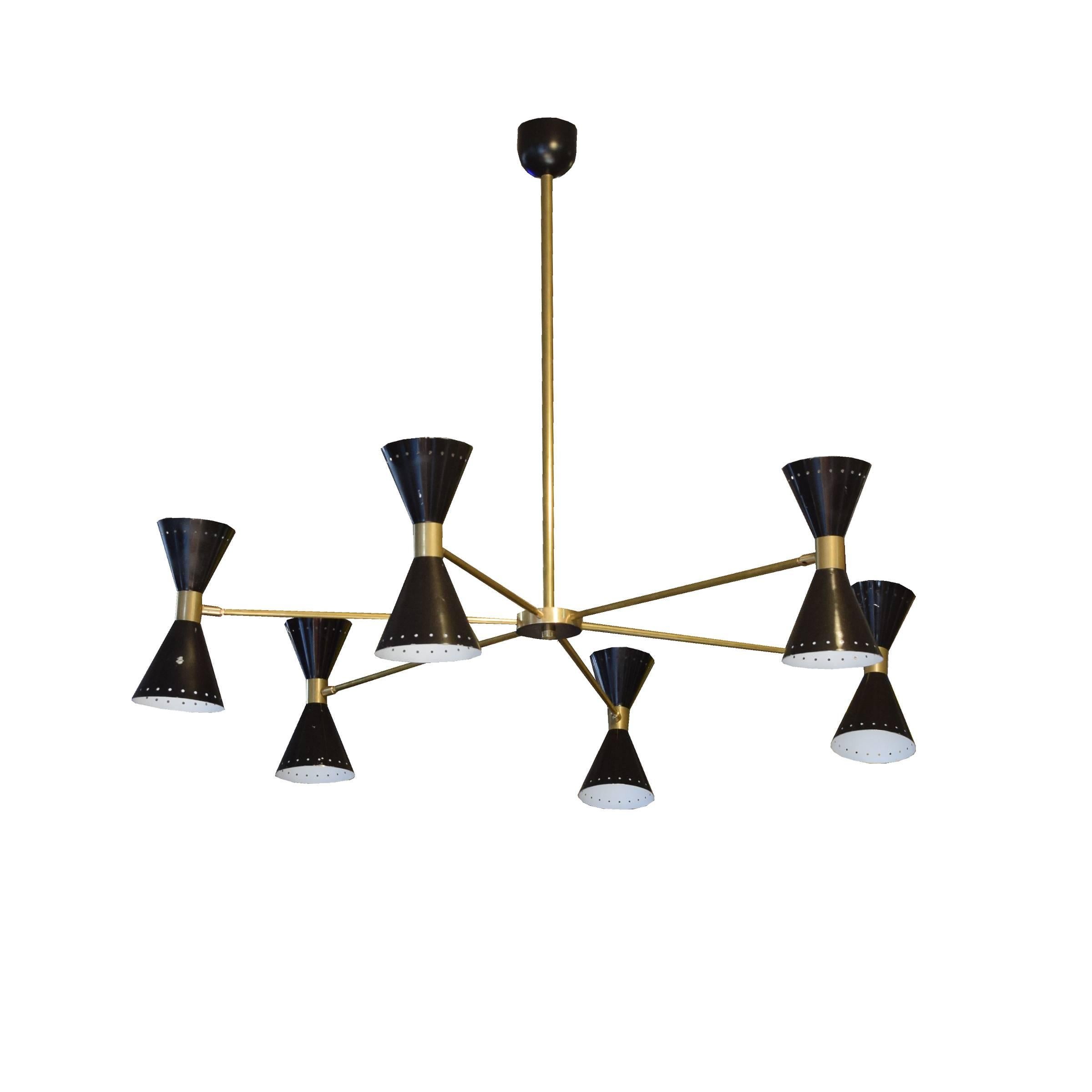 An Italian chandelier in the style of Stilnovo with a brass downrod and six brass arms ending in adjustable black enamel shades, each with up and down shining lights.
Requires re-wiring.