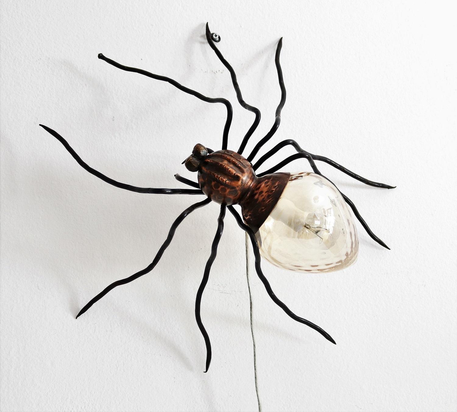 Gorgeous spider lamp with nine legs, made in Italy, circa 1960s.
This lamp is a typical outdoor lamp mounted over the entrance door of Italian houses of the 1960s. Nowadays they are requested design objects to be used also indoor.
Made of solid