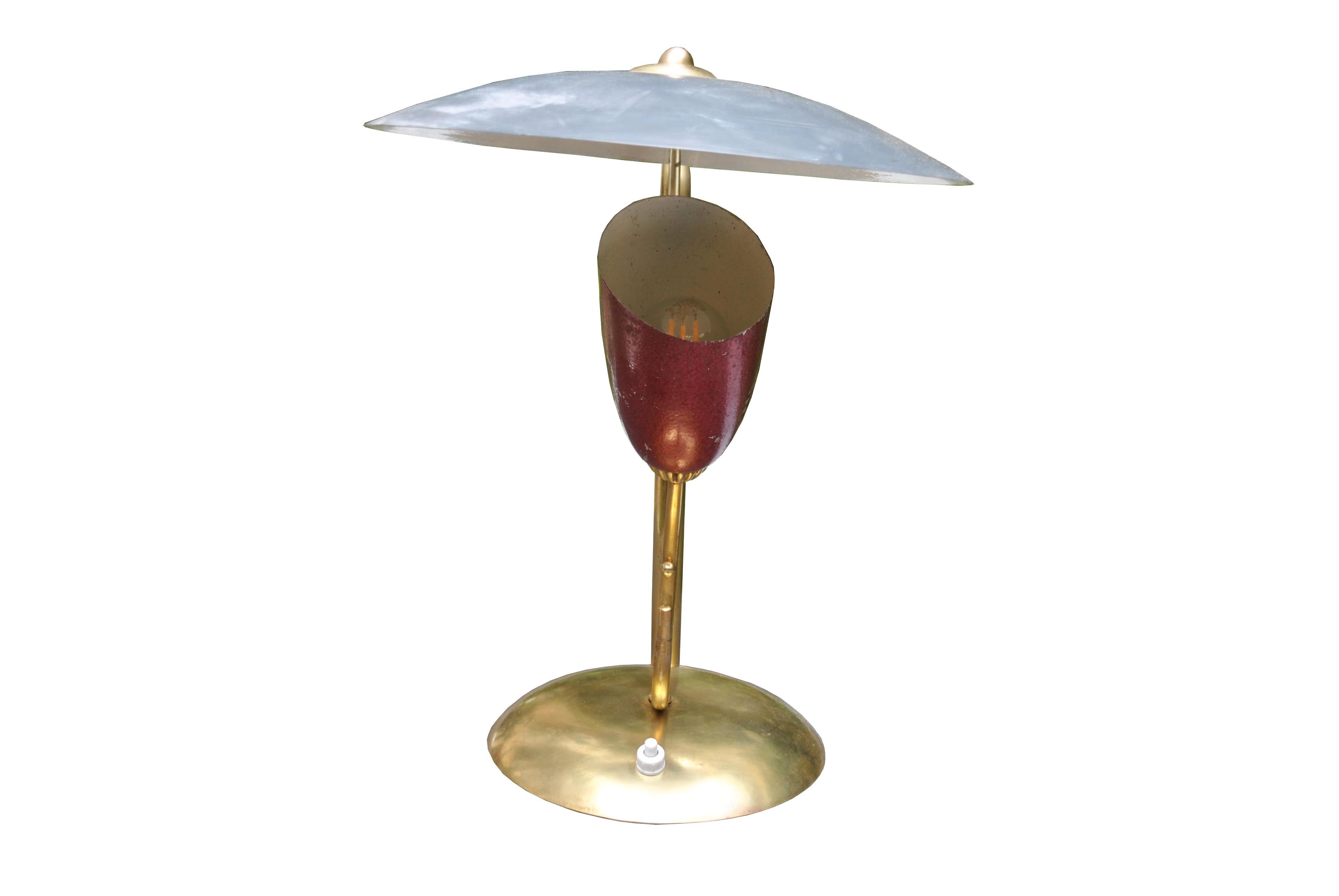 Midcentury table lamp after Angelo Lelli, designer and founder of the Italian company Arredoluce.
The structure is fully in brass with an aluminium cover.