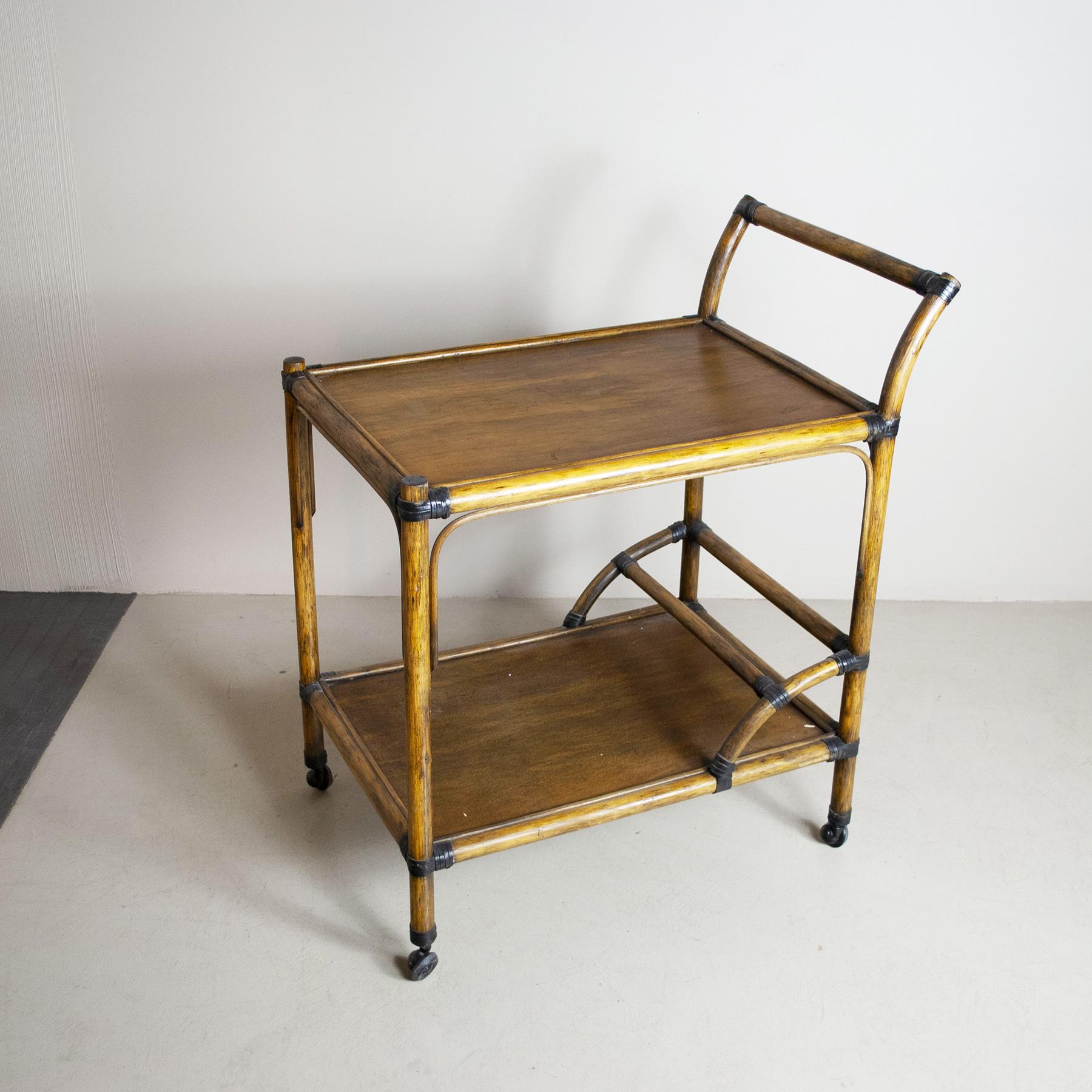 Liquor bottle trolley in bamboo cane with shelves in light walnut wood from mid sixties.