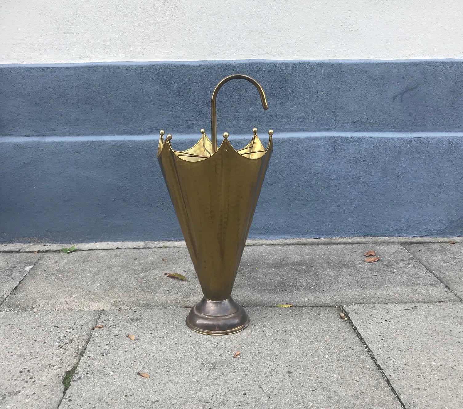 Italian umbrella stand shaped as an umbrella. Made entirely from brass, partially hammered. Anonymous Italian maker, circa 1950.
  