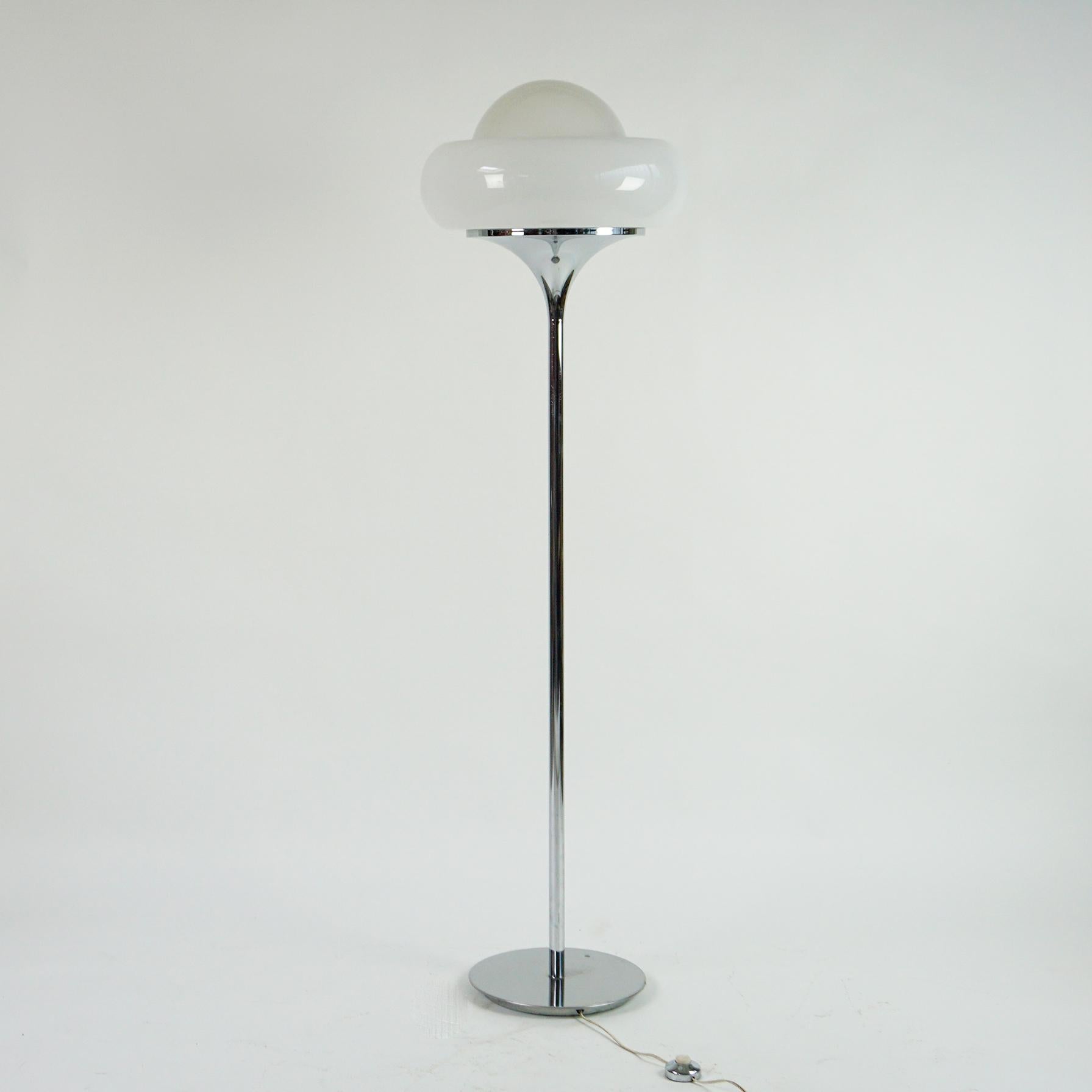 This iconic large Italian Floor lamp is designed by Harvey Guzzini for Guzzini in the 1960s, 
Chromed metal round base with a cast iron counterweight inside. Long chrome rod. Chrome round conical lampshade holder, white perspex shade with white