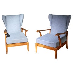 Italian mid‑century wingback lounge chairs, 1950s