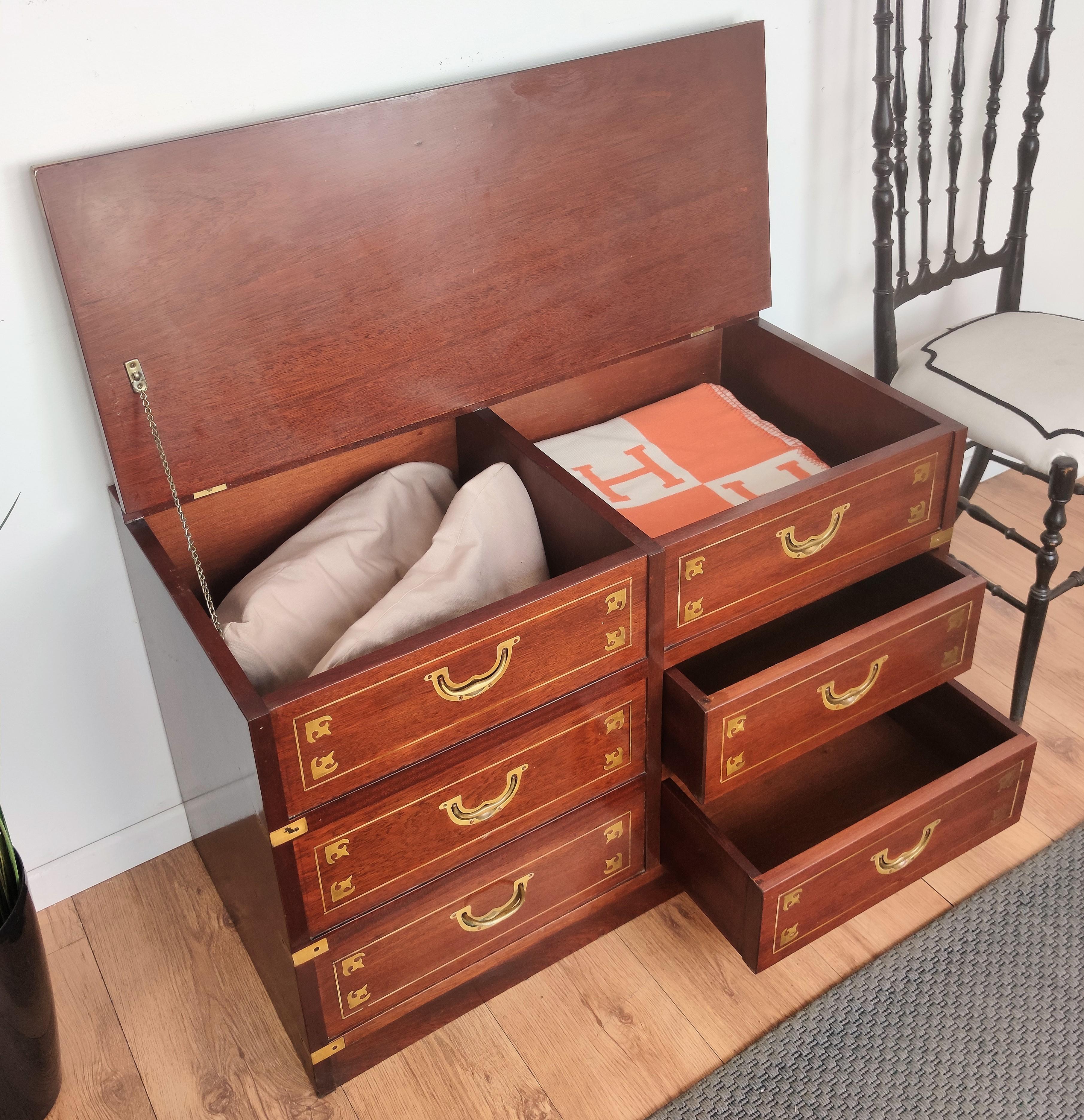 A vintage marine military campaign chest from the late 20th century, with six drawers and brass hardware. Created during the late midcentury modern period it is inspired by the typical campaign military style from 19th army chests. Its