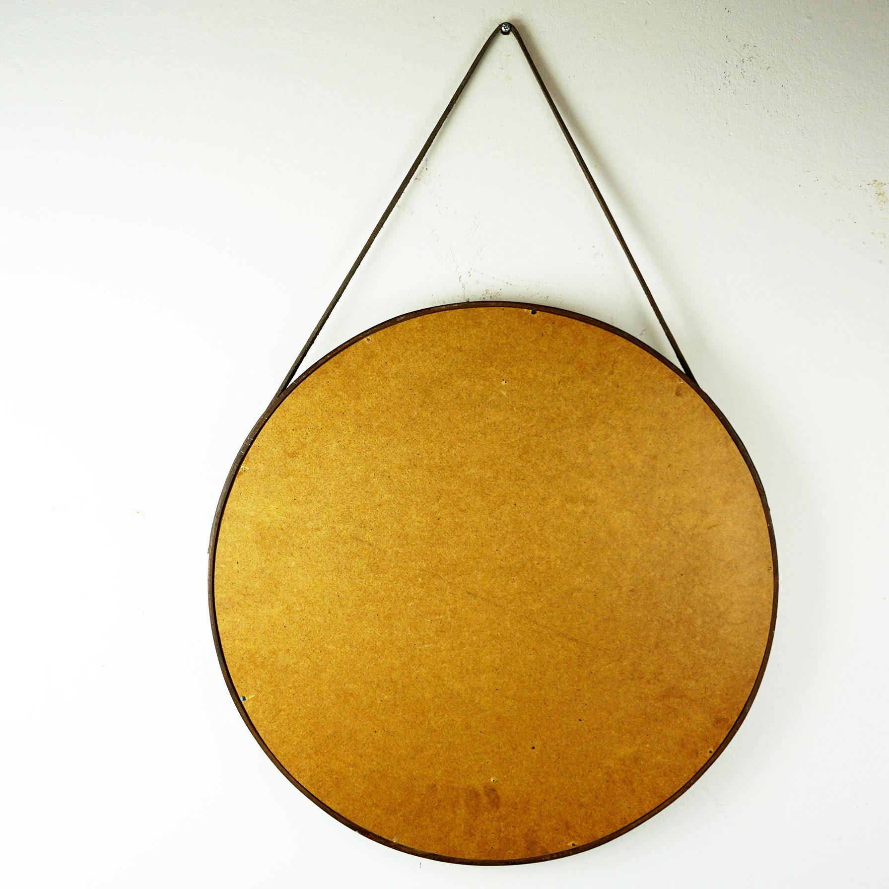Excellent handcrafted Italian 1950s wall mirror with leather strap.