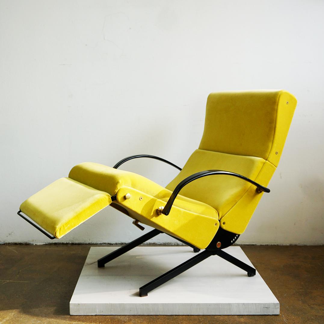This Fantastic Italian Midcentury adjustable and reclinable iconic P 40 Lounge chair was designed by Osvaldo Borsani for Tecno, Italy, 1950s.
Black painted steel, brass details and renewed yellow velvet by Raf Simons for Kvadrat. Metal tag: Blue T