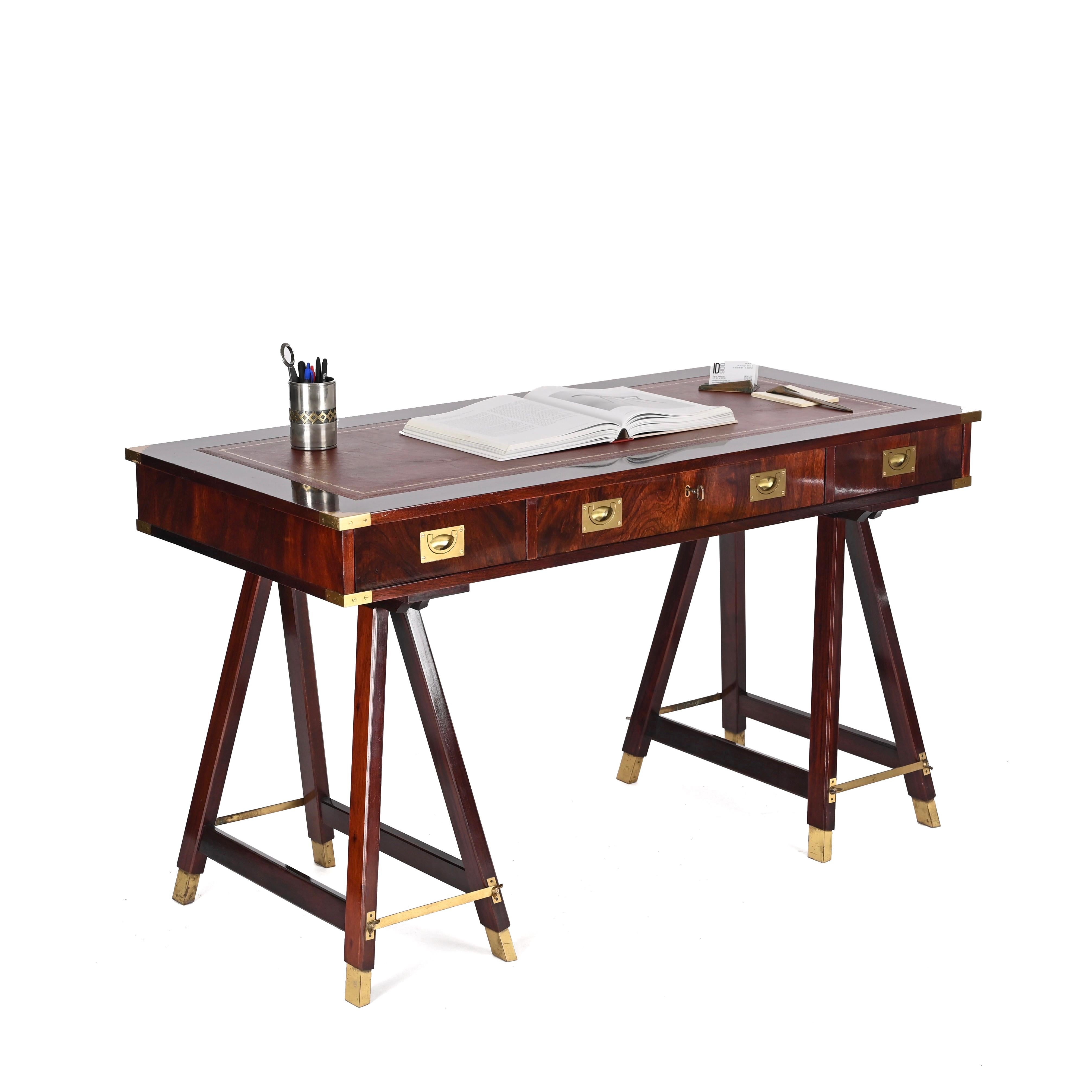 Stunning Mid-Century military campaign style desk. This fantastic piece was produced in Italy and is signed by Sea Line Orvieto in the 1960s.

This desk is made in a marvelous wood with outstanding wood grains, the top is decorated with its original