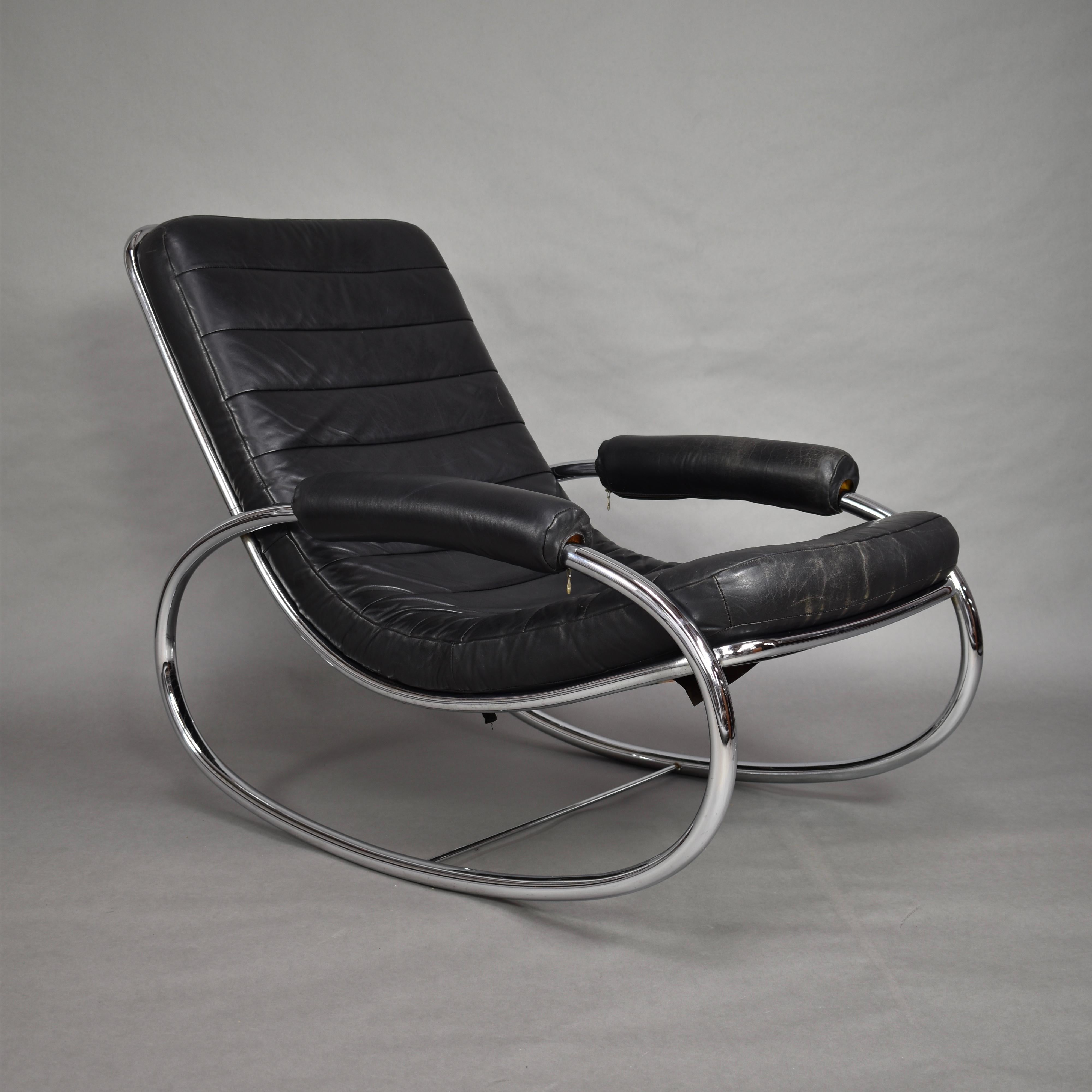 Italian rocking chair in the style of Milo Baughman or Guido Faleschini.

Designer: Unknown

Manufacturer: Unknown

Country: Italy

Model: Rocking chair

Design period: 1970s

Date of manufacturing: 1970s-1980s

Size cm: W 115 x D 70 x