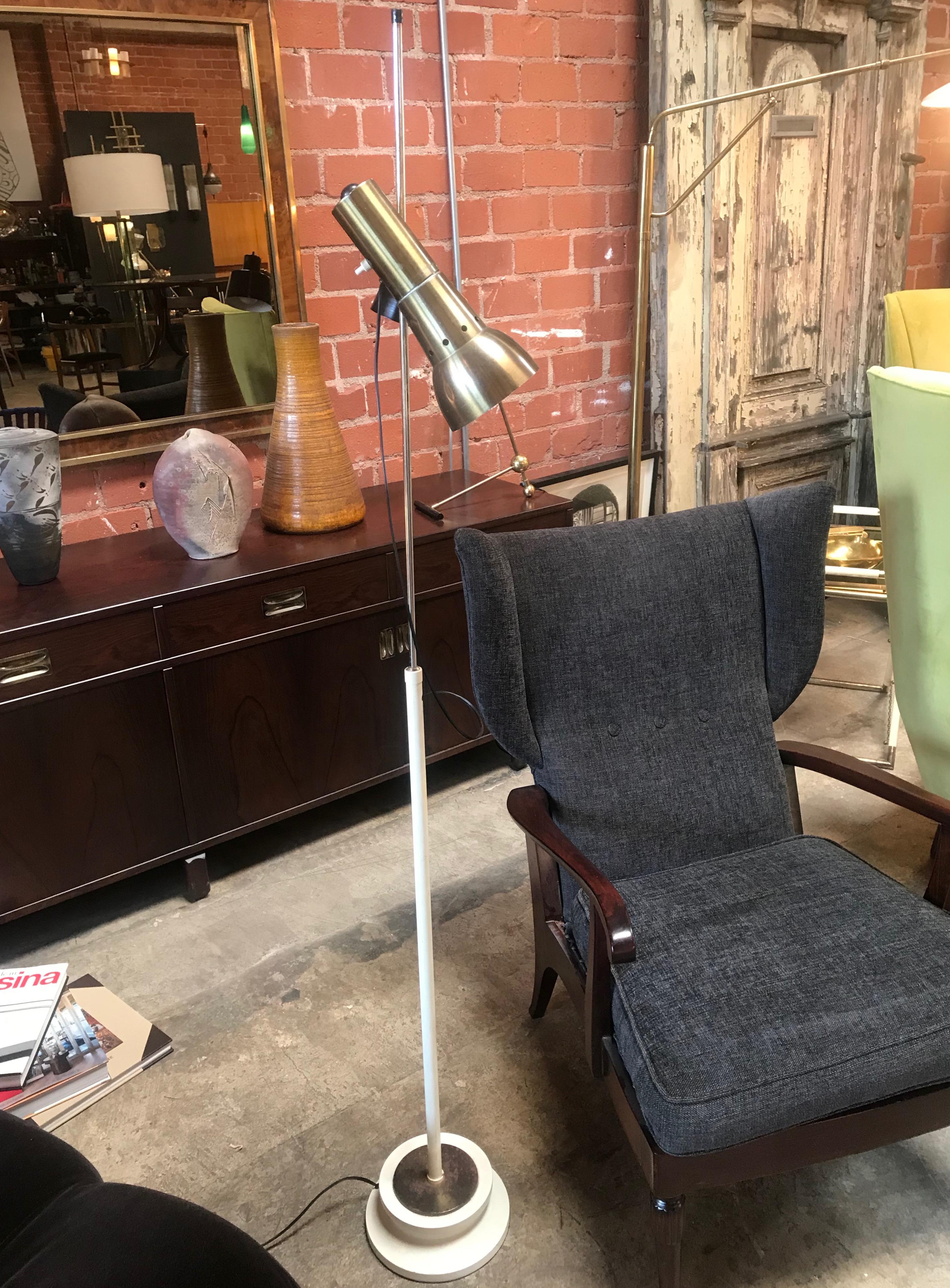 Minimalist Italian designs of the midcentury: a highly adjustable floor light, the brass shade can be rotated up/down and right/left.
Diameter brass spot is 4.5 in.
Lightly used, with very light scratches, or minor cosmetic wear, but has no
