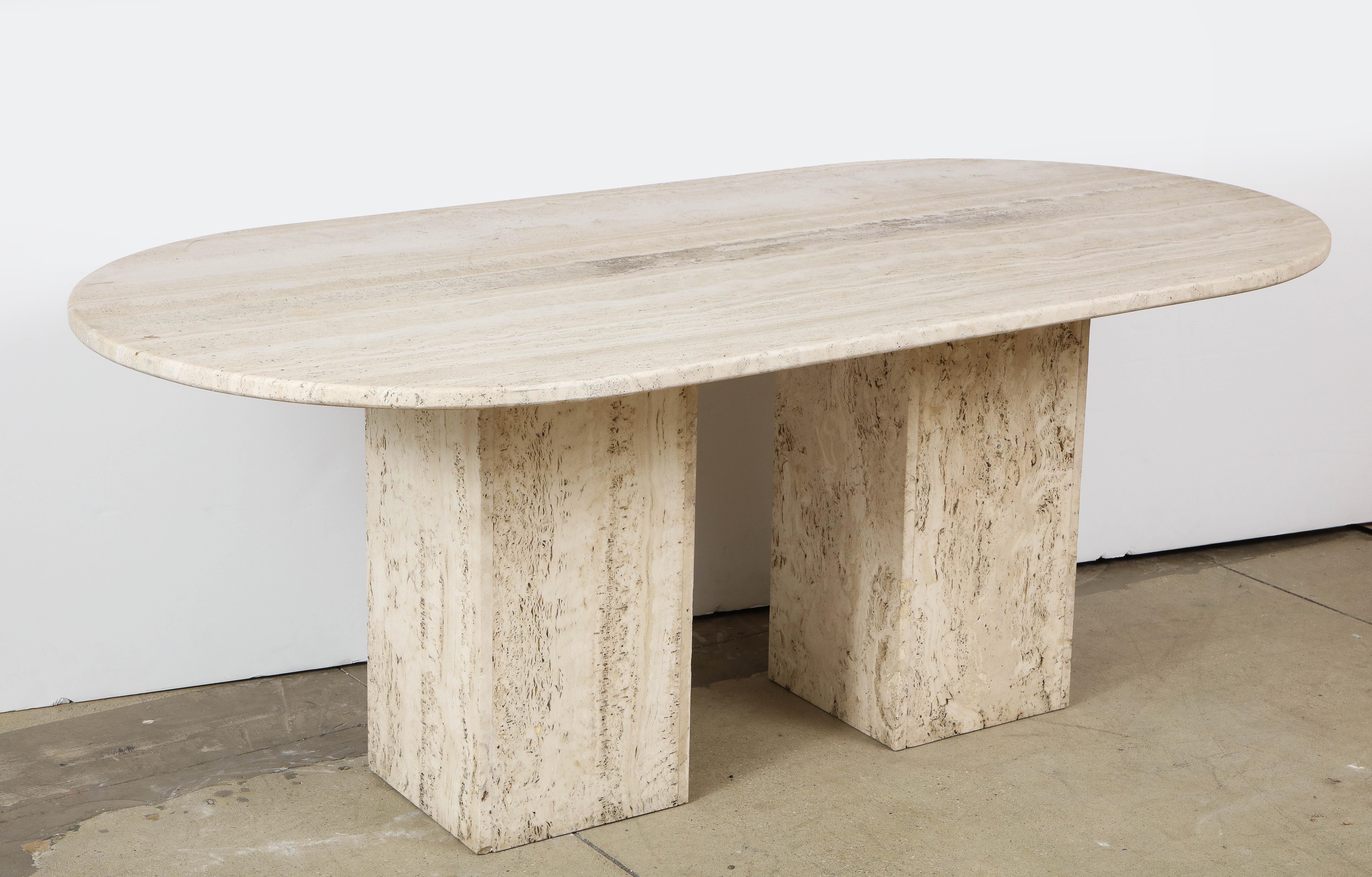 Italian Minimalist Roman travertine dining table, Italy, circa 1970s
Racetrack oval, in three pieces.
Measure: H 30.75, D 39.33, L 79 in.

     