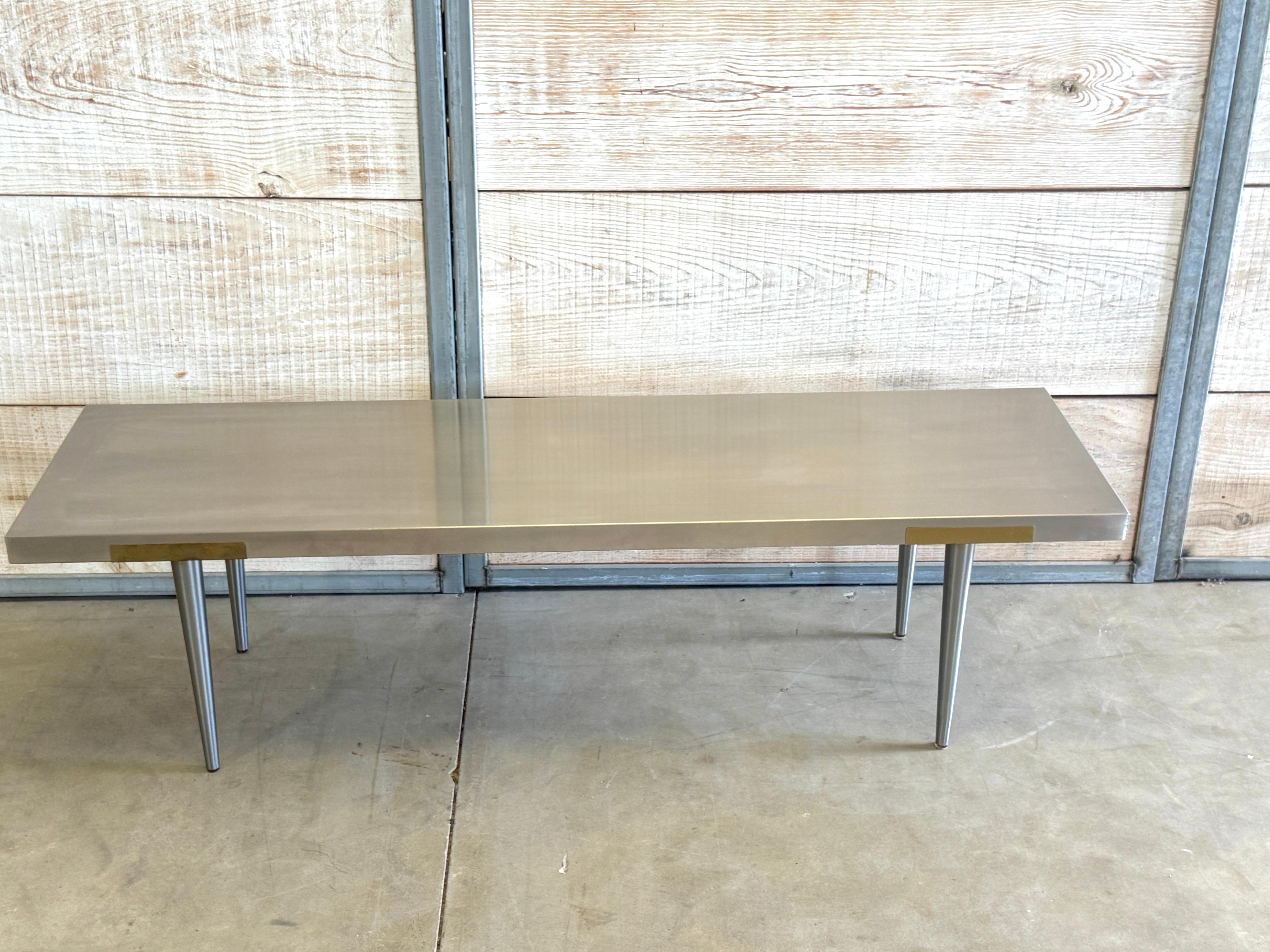 Italian Minimalist Bench or Coffee Table Attributed to Giuseppe Rivadossi Studio, Stainless Steel and Brass, 1980s

Note: The lead image shows a shadow cast from the wall; this is not a mark on the surface. The piece has a consistent, even color and