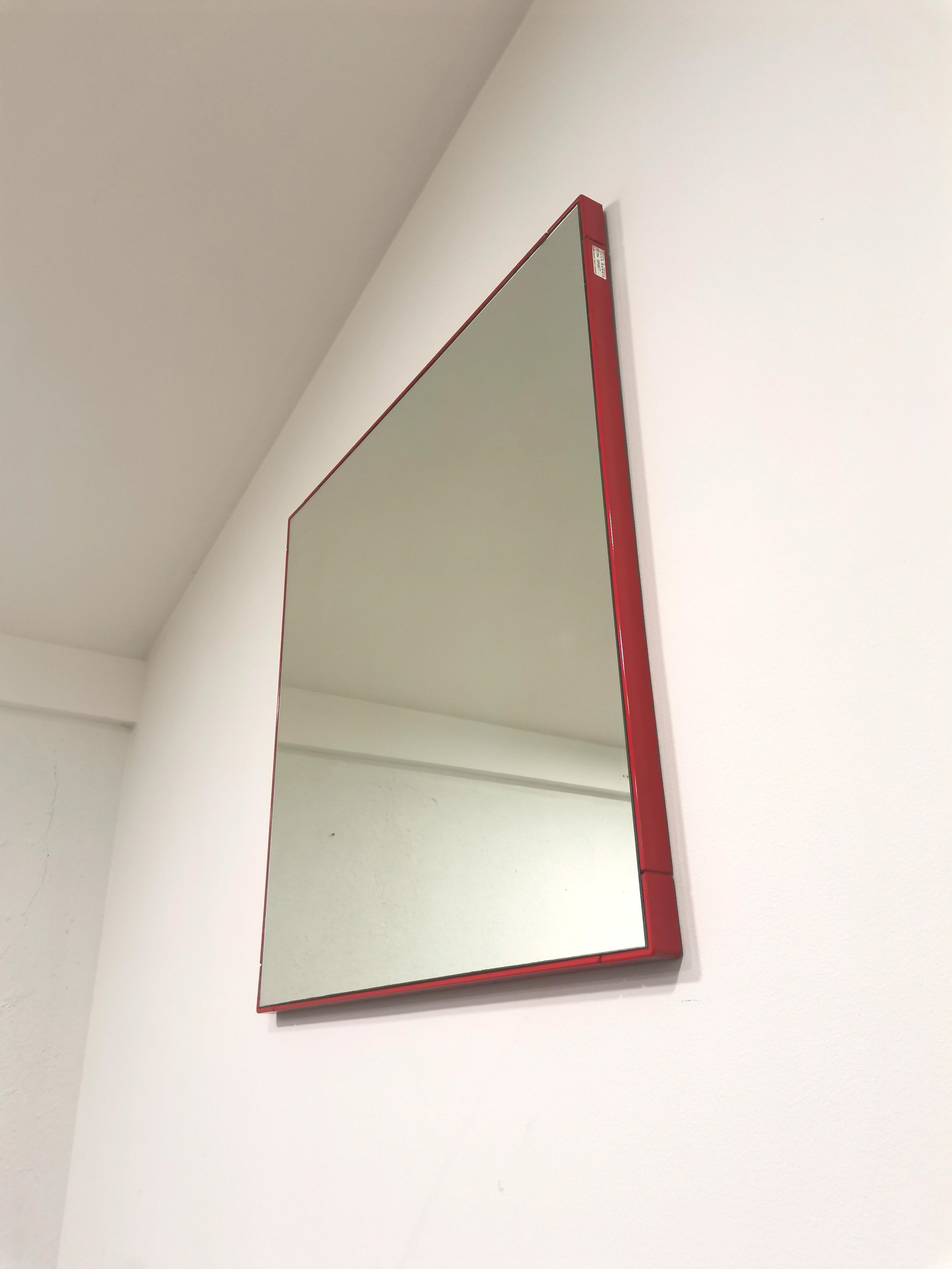 Vintage Italian Mirror. Made in 1970s. Simplicity of form and eternal design. This mirror will upgrade any room with its minimalistic aesthetic and vivid red colour. 

Material: plastic, mirror.

Condition:v ery good vintage condition with some
