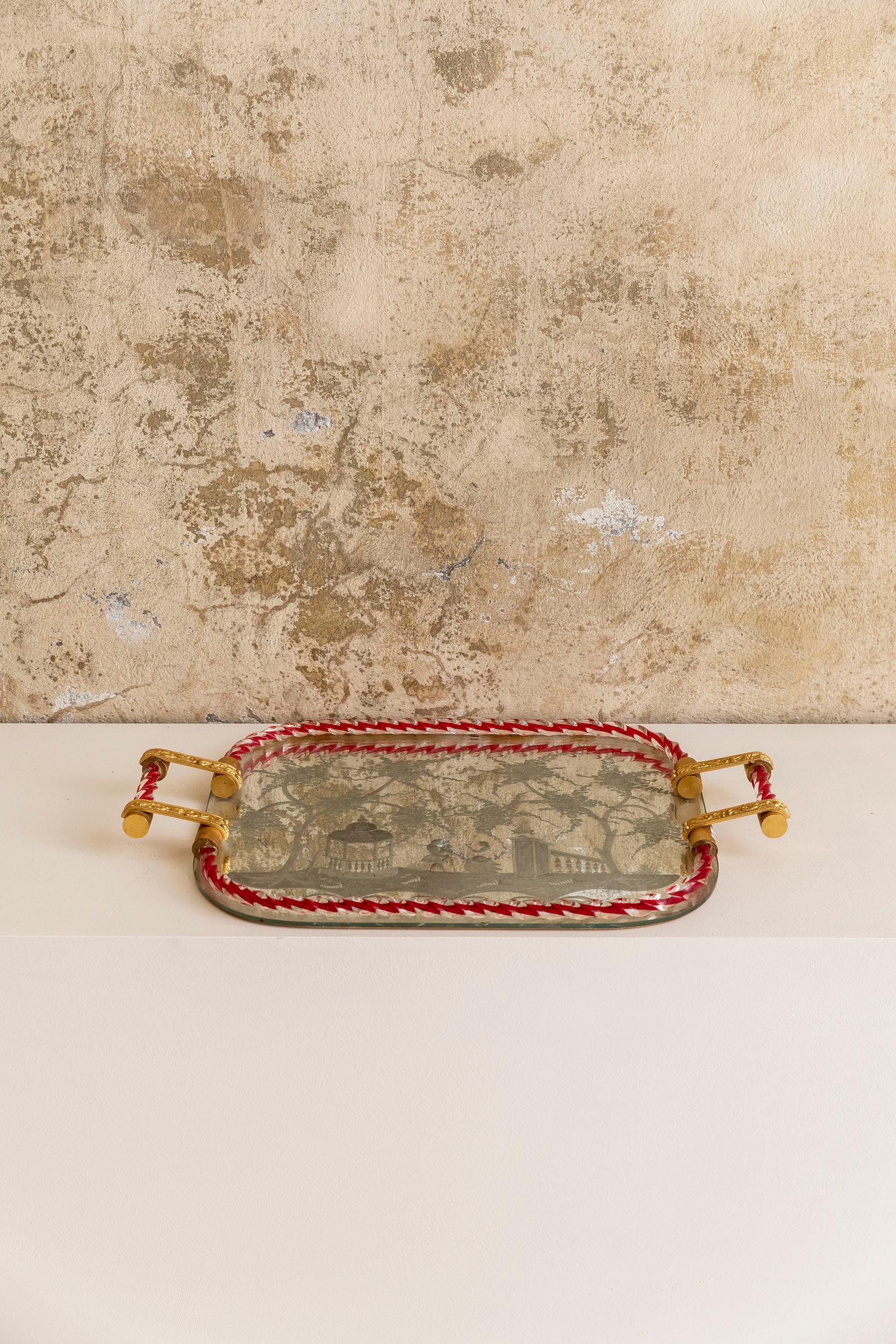 Midcentury mirror-engraved Murano glass serving tray. This wonderful piece was produced in Italy during 1940s by Ercole Barovier. This item is a peculiar Venetian vintage tray with a mirror base on a wooden plate and golden embellished brass
