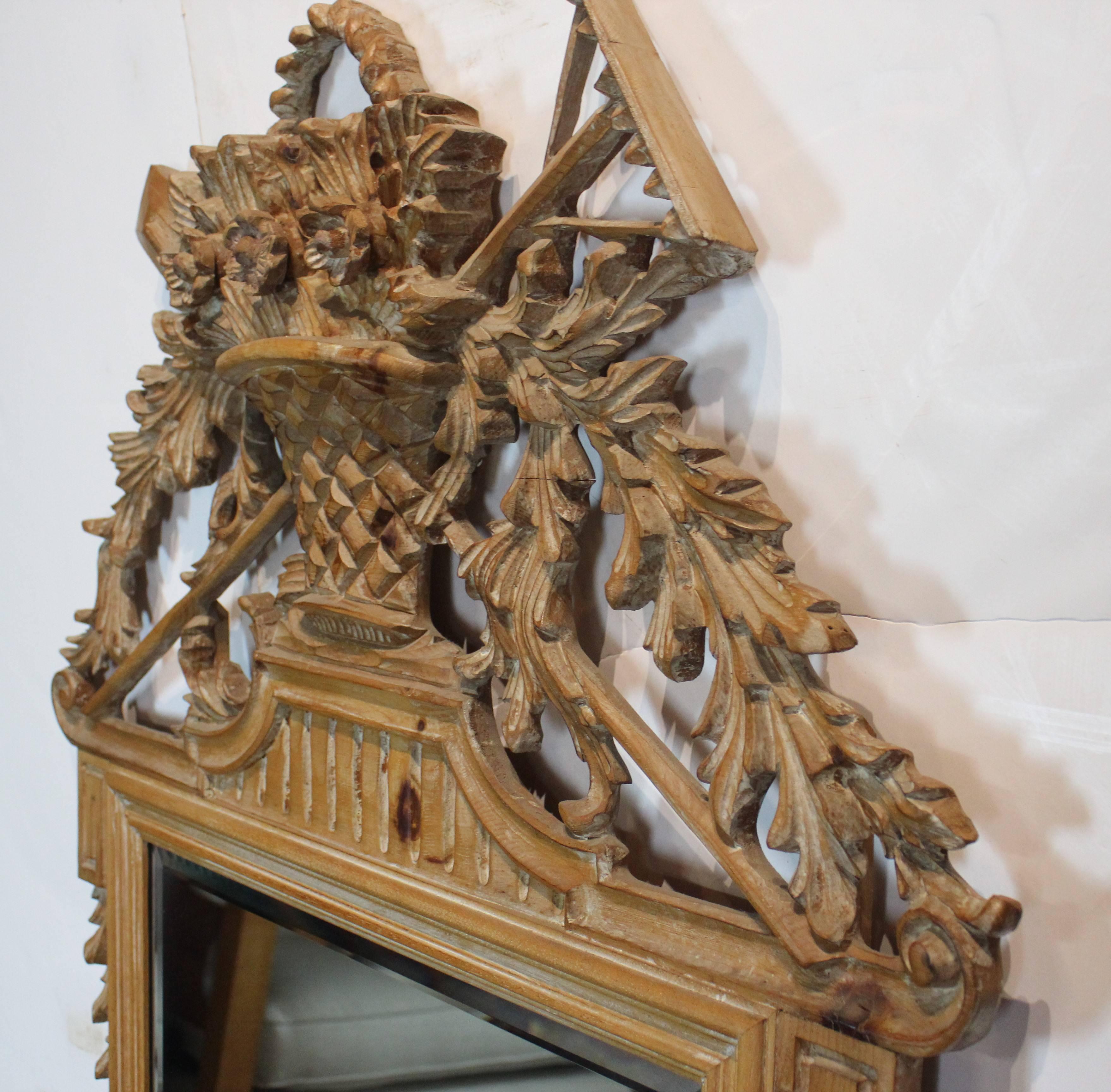 Wood carved natural finish Italian mirror with bevelled edge mirror.