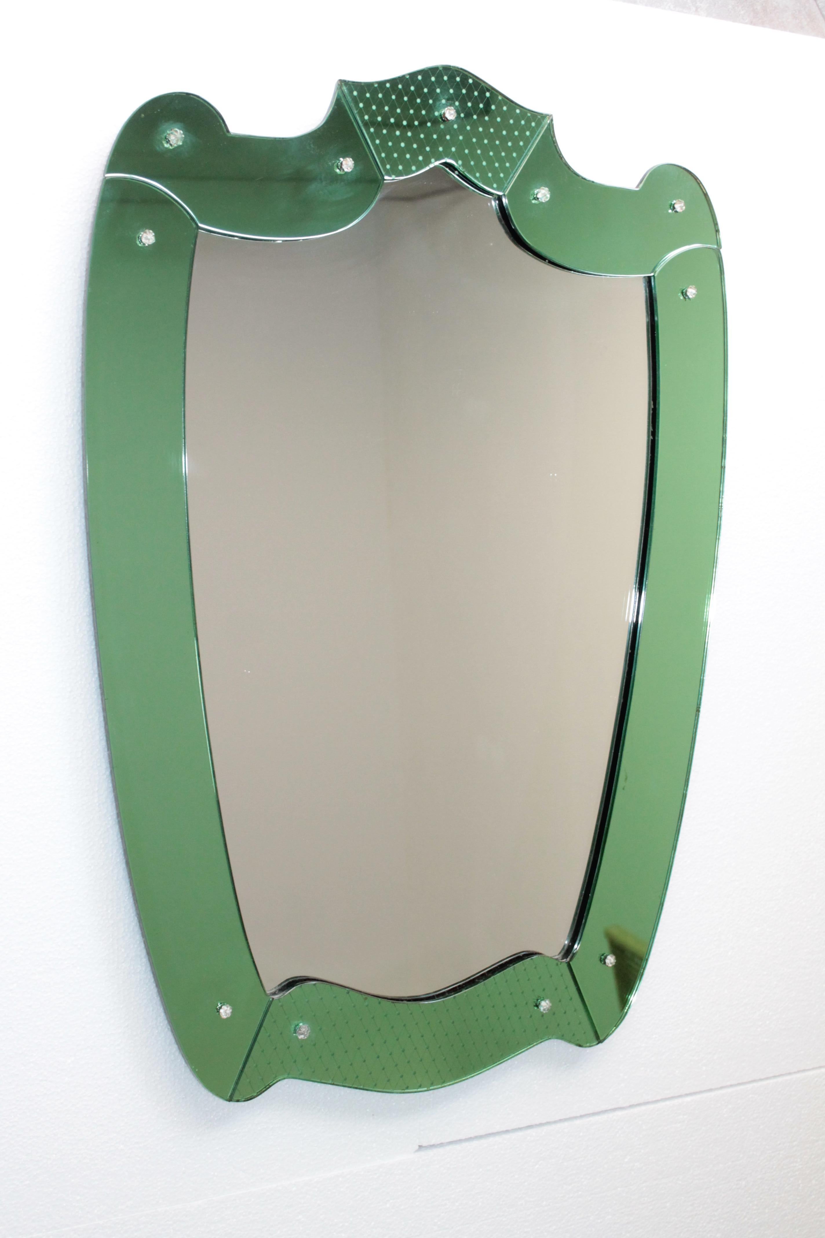 Wonderful mirror design Pietro Chiesa, Fontana Arte, 1940s.
Good condition.
Dimensions: 85 x 60cm.