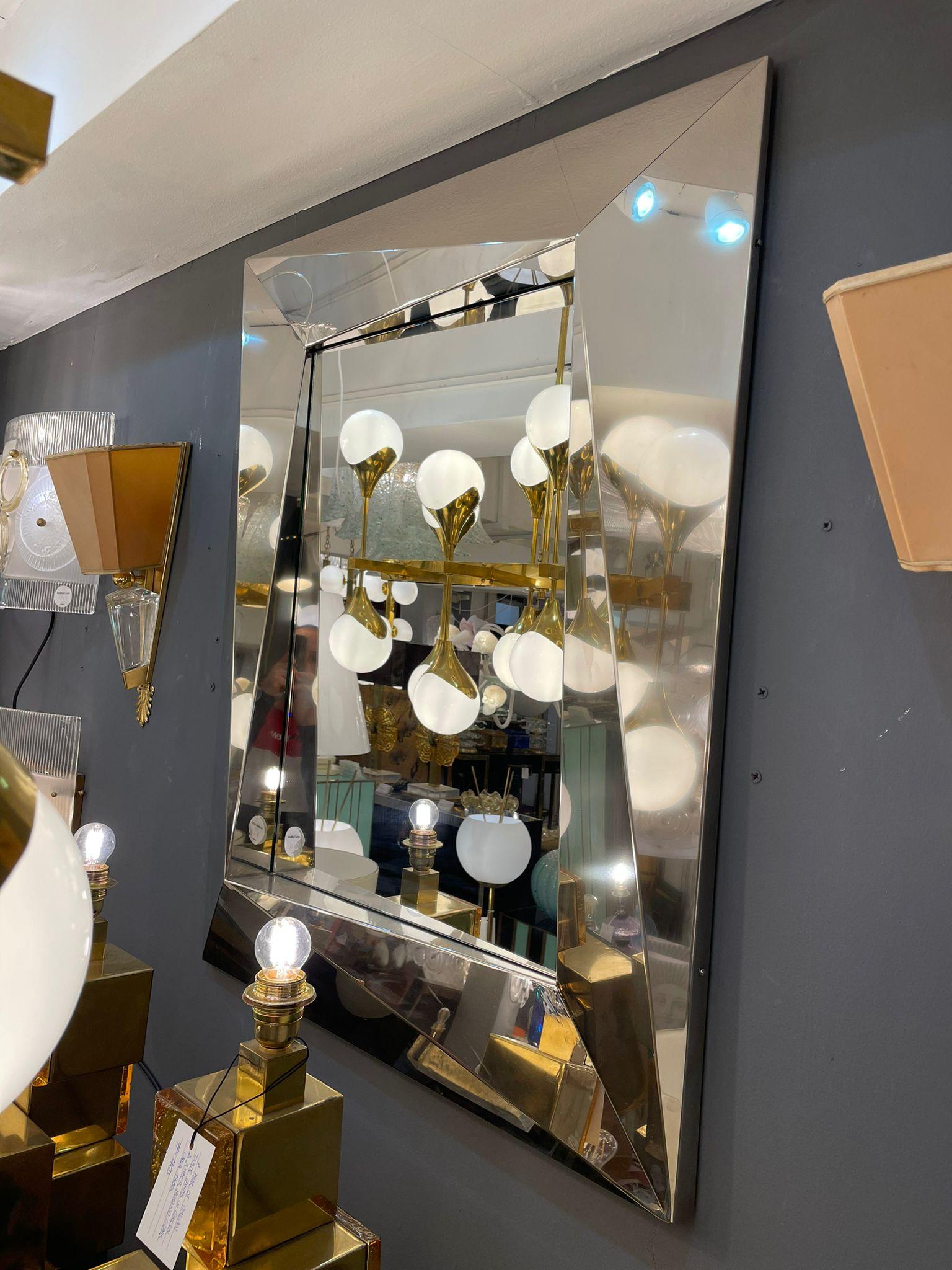 An elegant Italian Mirror in Chrome with geometric decorations, circa 1980.
