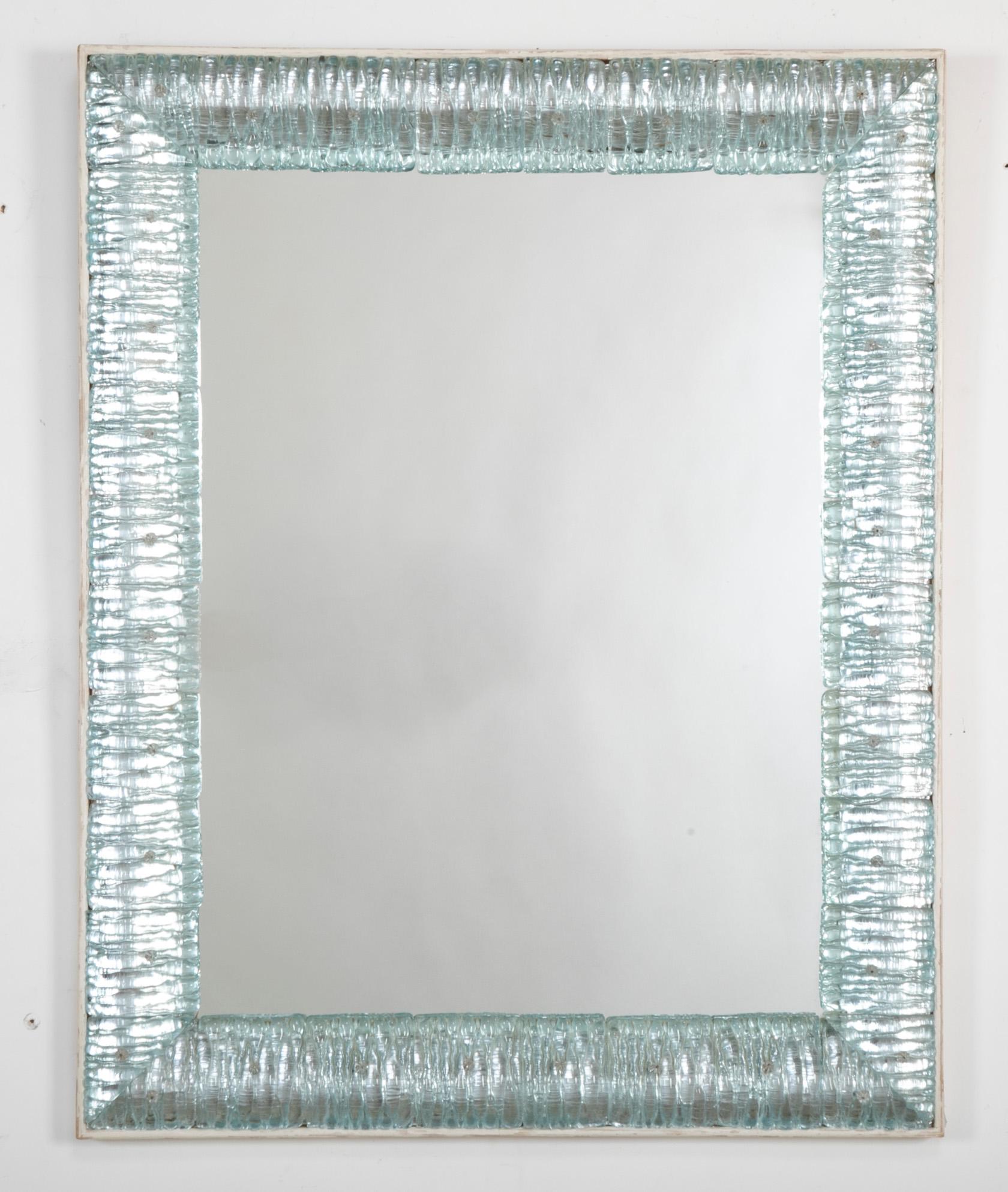 Italian mirror with Murano aquamarine glass frame.