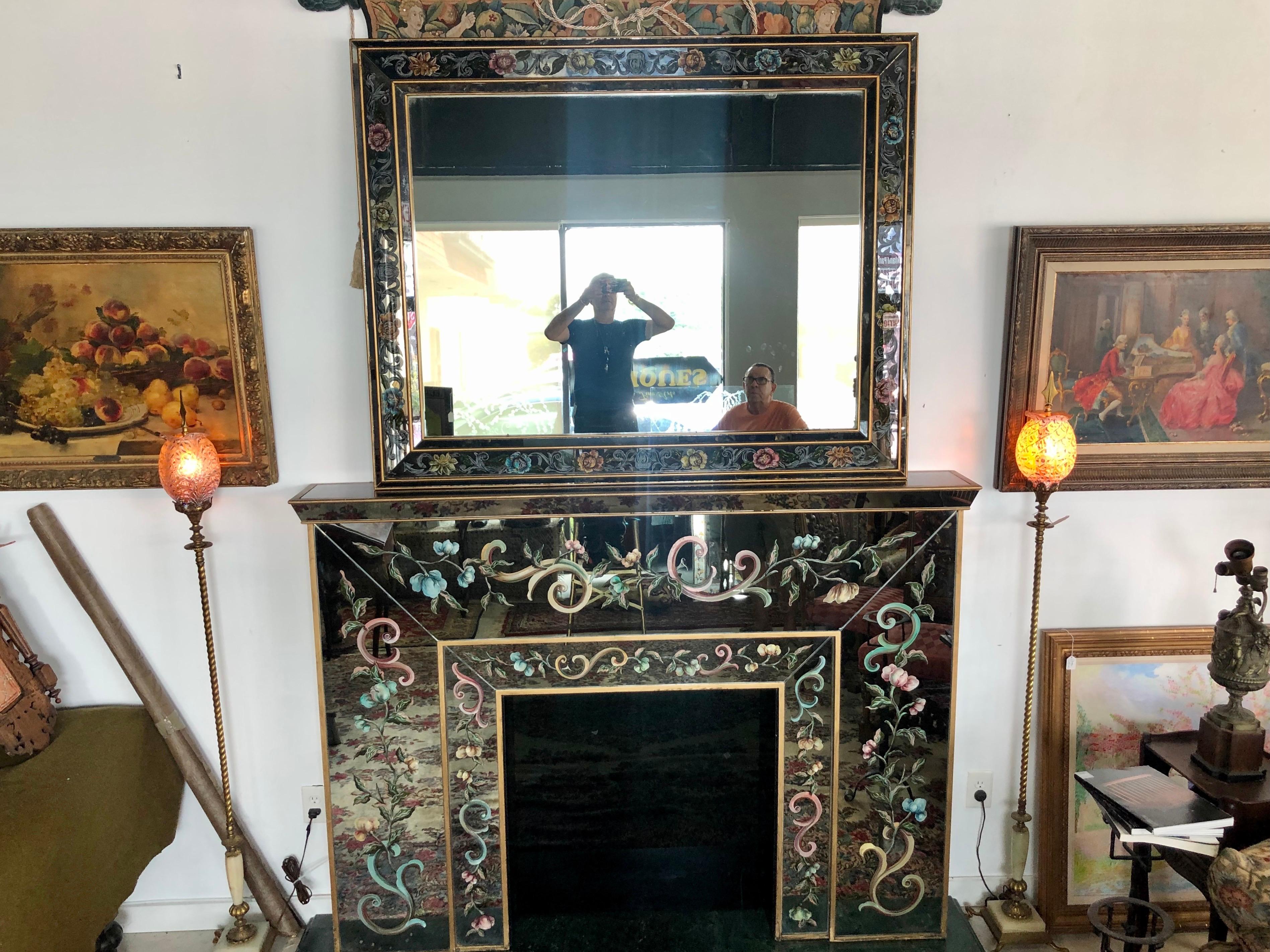 Extremely rare set of large Italian mirrored Eglomise fireplace mantel and matching mantel mirror with delicate hand painted floral decor, framed in bronze and sitting upon venetian green marble base. The set is in very good condition.
Mirror