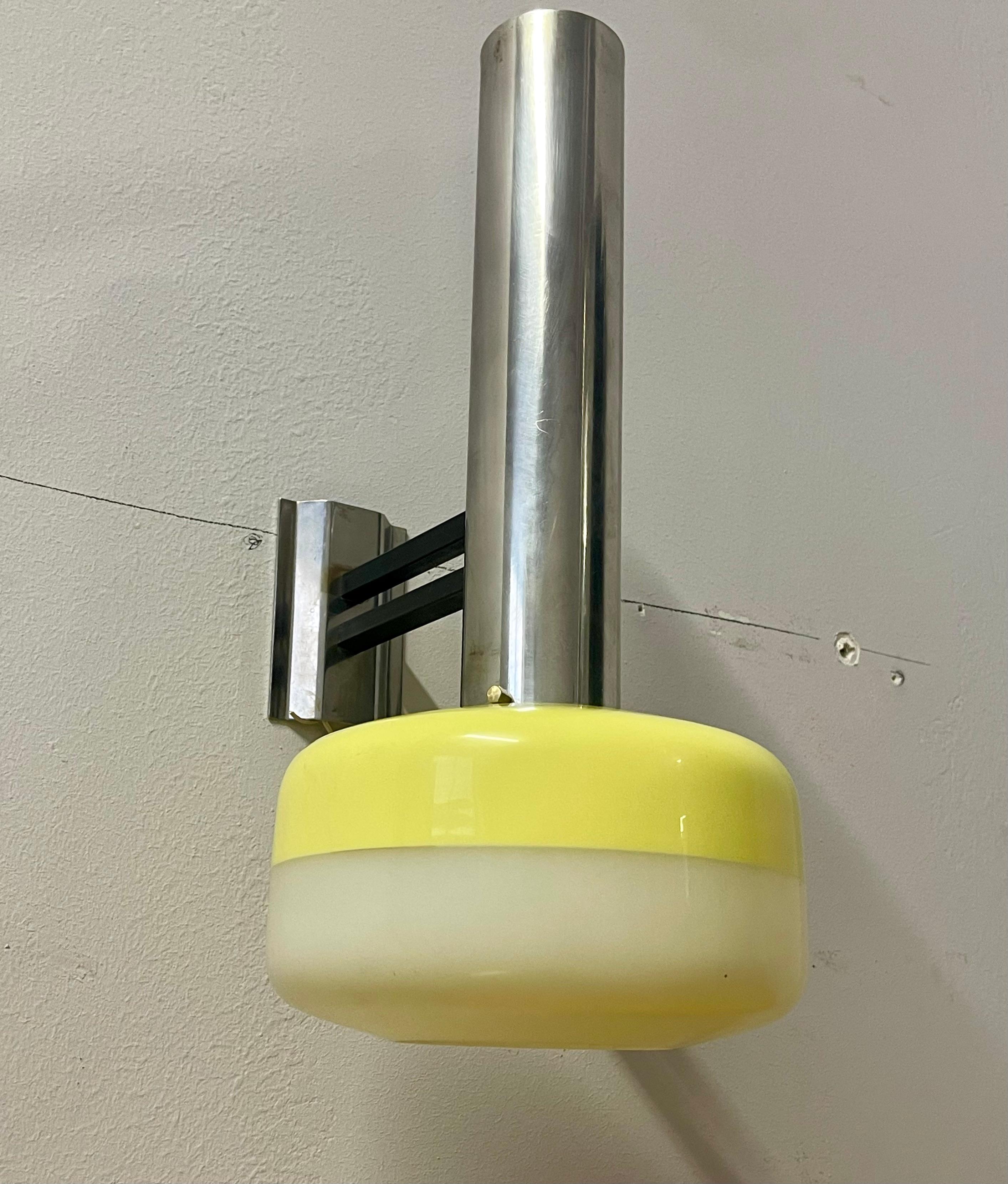 Very rare wall sconce, model 2108, designed and produced by Stilnovo, Italy 1960. This lamp has a polished aluminum tubular frame with perspex diffuser in white and soft yellow colors. factory label on the back.
Edit description