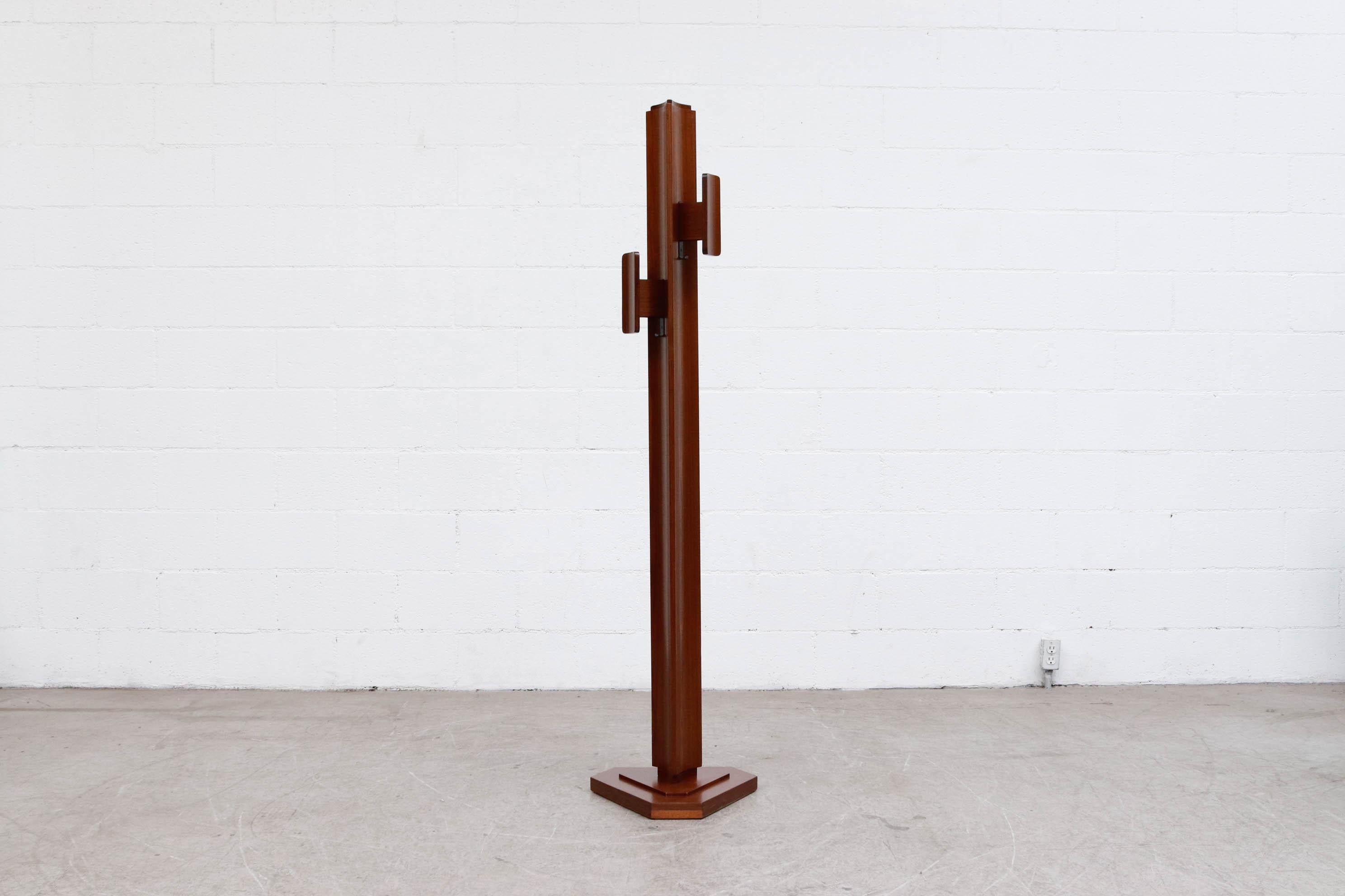 Italian Mod Brutalist style coat tree. Stunning triangular design with big block hooks (hooks measure 3.75 W x 7.875 H) in good original condition with light refinishing to the wood.