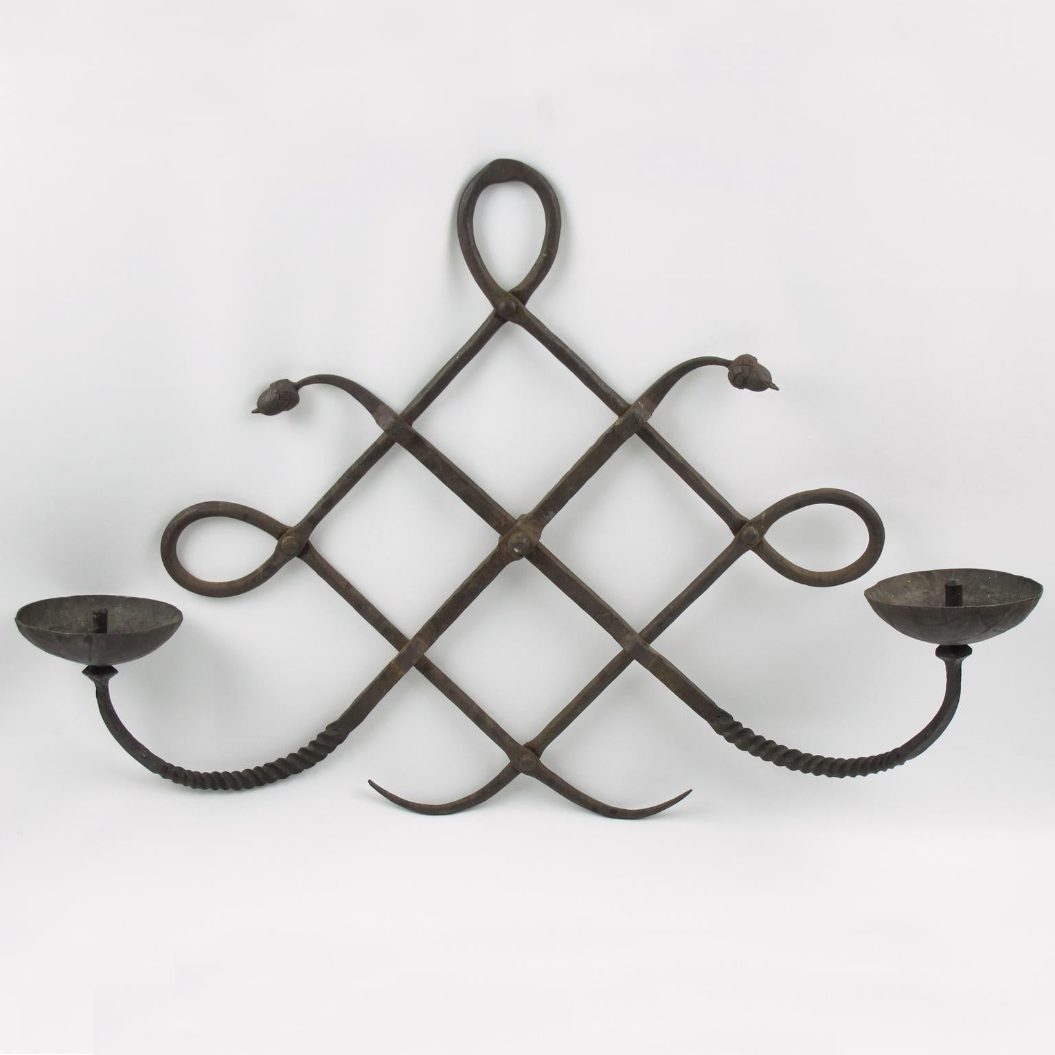 Arts & Crafts Italian 1970s wall candleholder sconce by Modarchitectura. Wrought iron with original patina, refined detailing with rope carving and oak acorn. Candelabra holds two candles. Engraved at the back: 