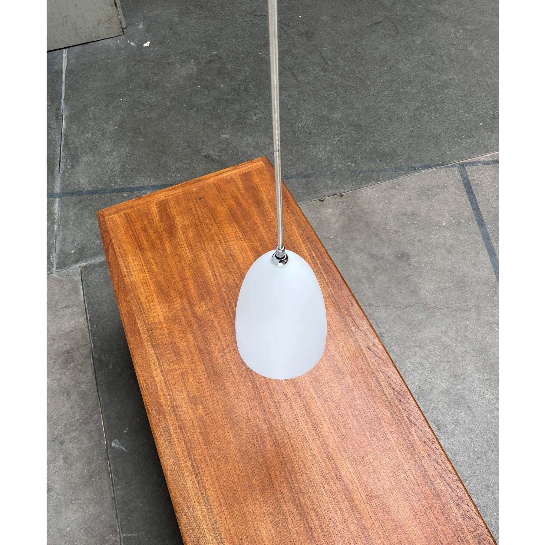 Rare pendant light from the italian manufacturer italiana luce/nemo.

an elegant design from italy. What makes this light special is the interplay of classic and technical materials. The shade has a classic shape and is made of opal glass. The