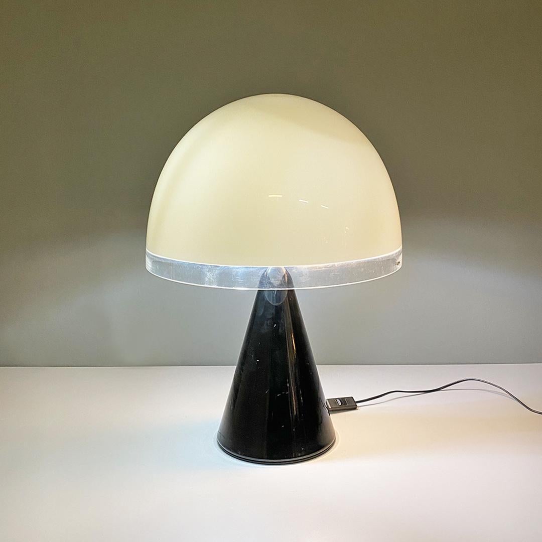 Italian moder black metal and white and transparent plastic Baobab table lamp by iGuzzini, 1970s.
Baobab model table lamp, with conical black metal base with E27 lamp holder in the upper part, where a threaded plastic support is placed on top, to