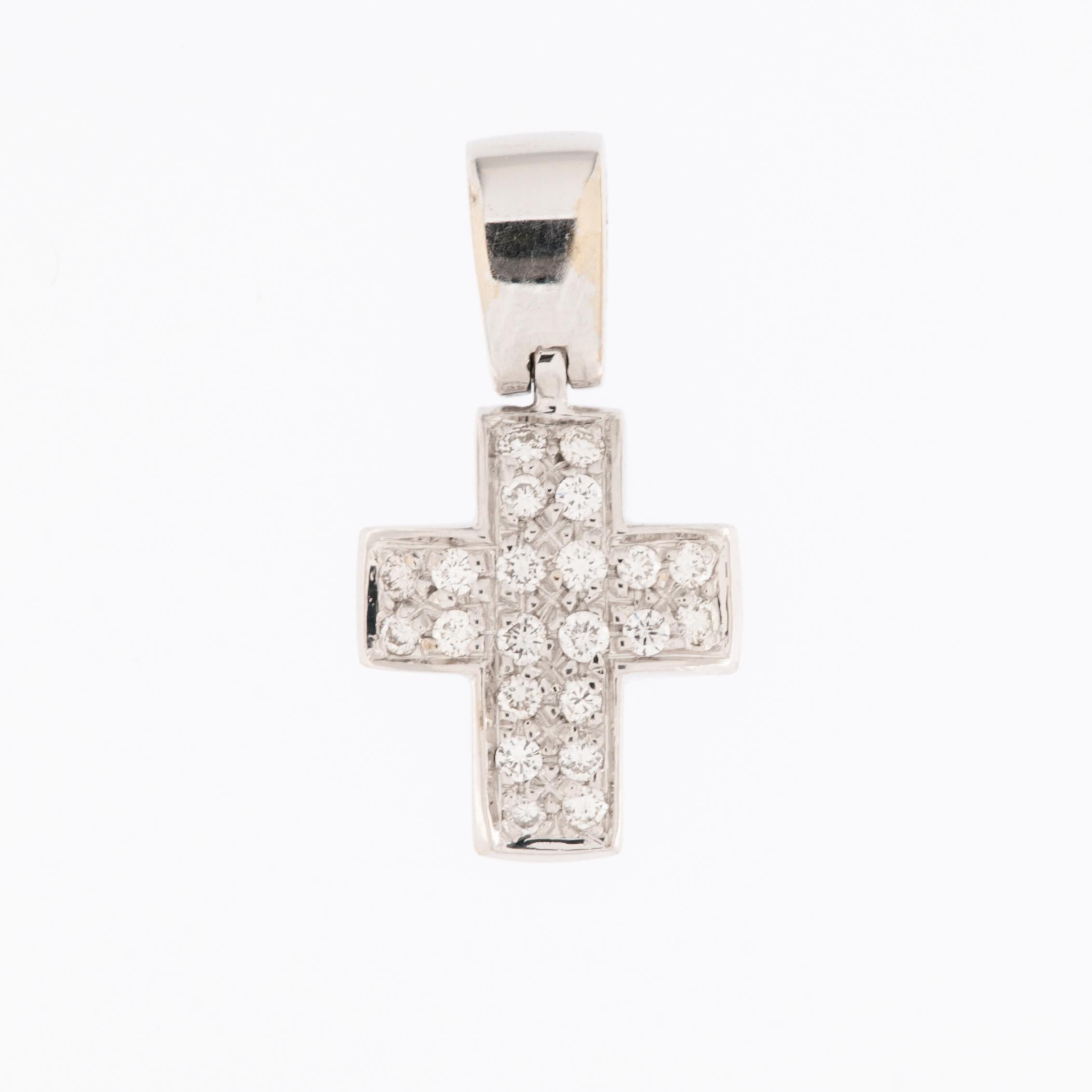 The Italian Modern 18kt White Gold Cross with Diamonds is a marvelous piece of jewelry that exudes elegance and timeless charm. 

This cross pendant is crafted from 18-karat white gold, which is known for its brightness. The use of high-quality gold