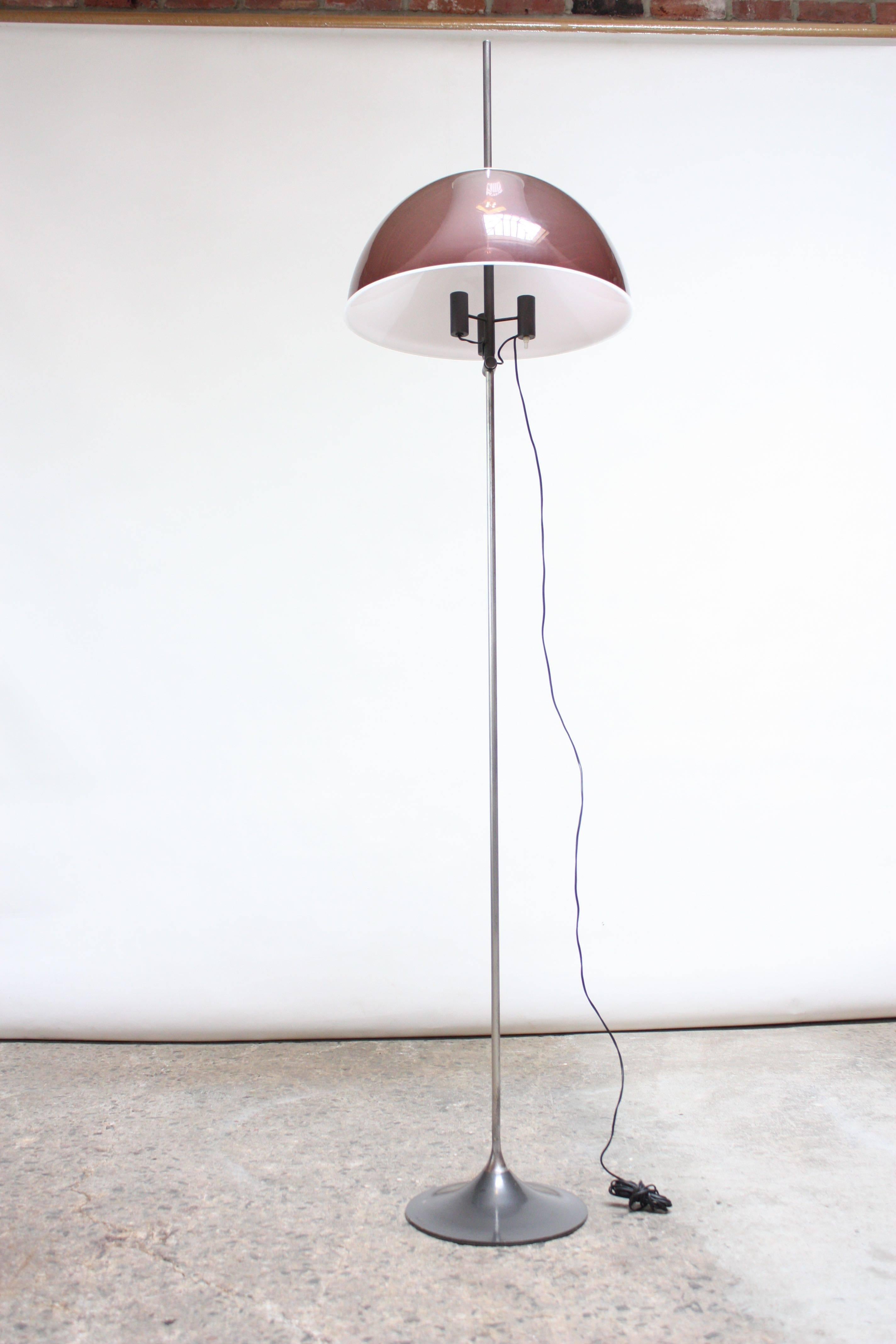 Italian floor lamp composed of dual shade (interior white and exterior light plum acrylic shade) mounted to a nickel plated steel rod on an enameled steel base. 
Shade height adjustability via a 'push-button' mechanism, allowing the shade to be