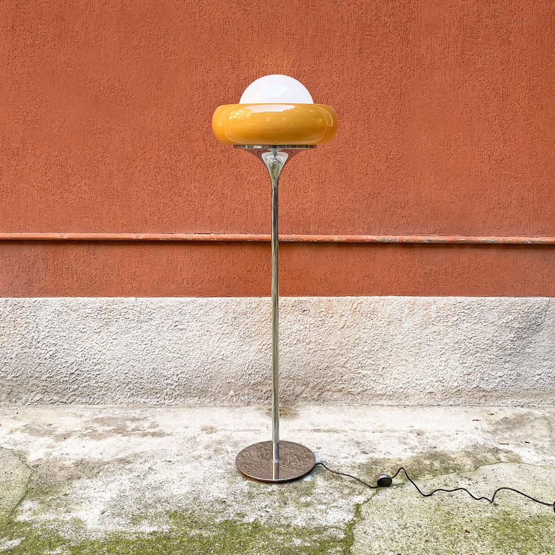 Italian modern amber plexiglass, glass and chromed metal floor lamp, 1970s
Floor lamp with round base and chromed steel stem, with amber plexiglass lampshade, open at the top where a white opaline glass sphere is housed.
In the style of Guzzini