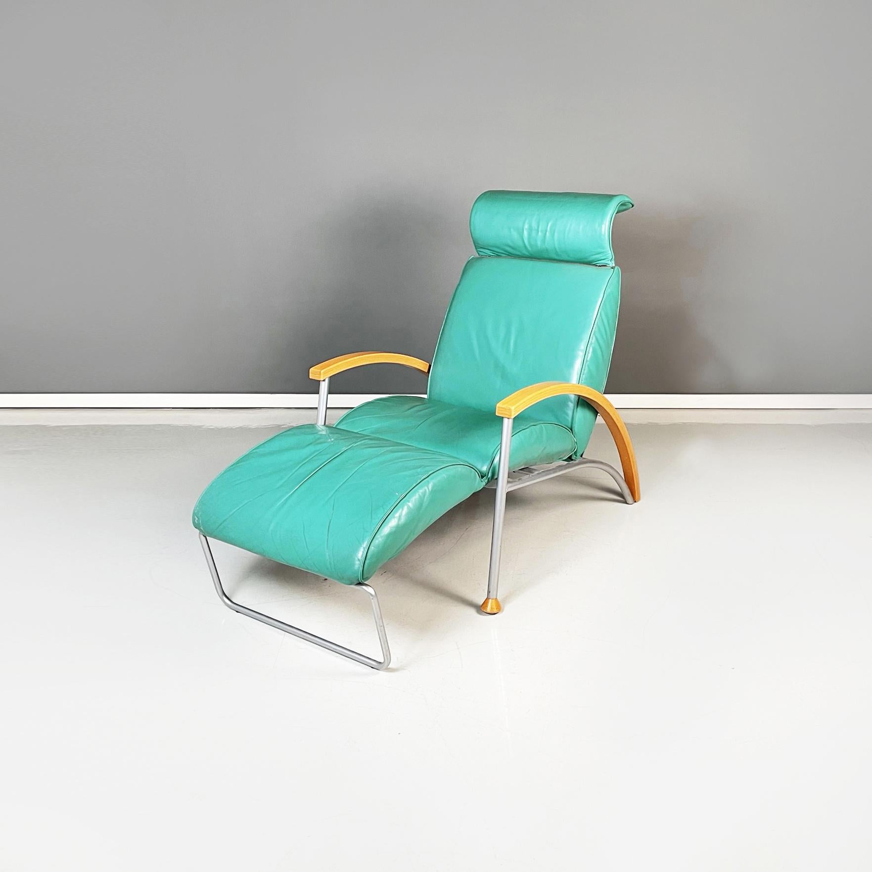 Italian modern Armchair in aqua-green leather, wood and metal, 1980s
Armchair upholstered in aqua-green leather. The seat is extendable thanks to a manual mechanism. The backrest is inclined. The curved armrests have a tubular metal and light wood